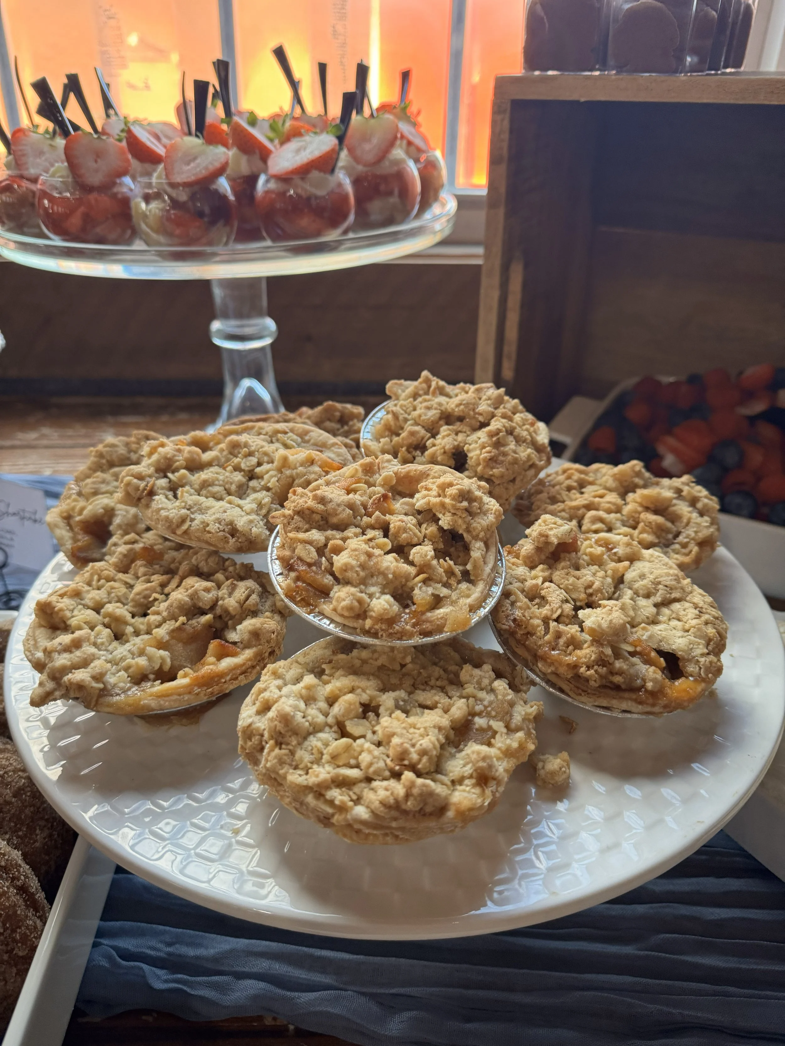 mattie and tristans modern industrial loft wedding the guild pawtucket rhode island dessert table mountain wedding cake apple crumble mini pies.jpeg
