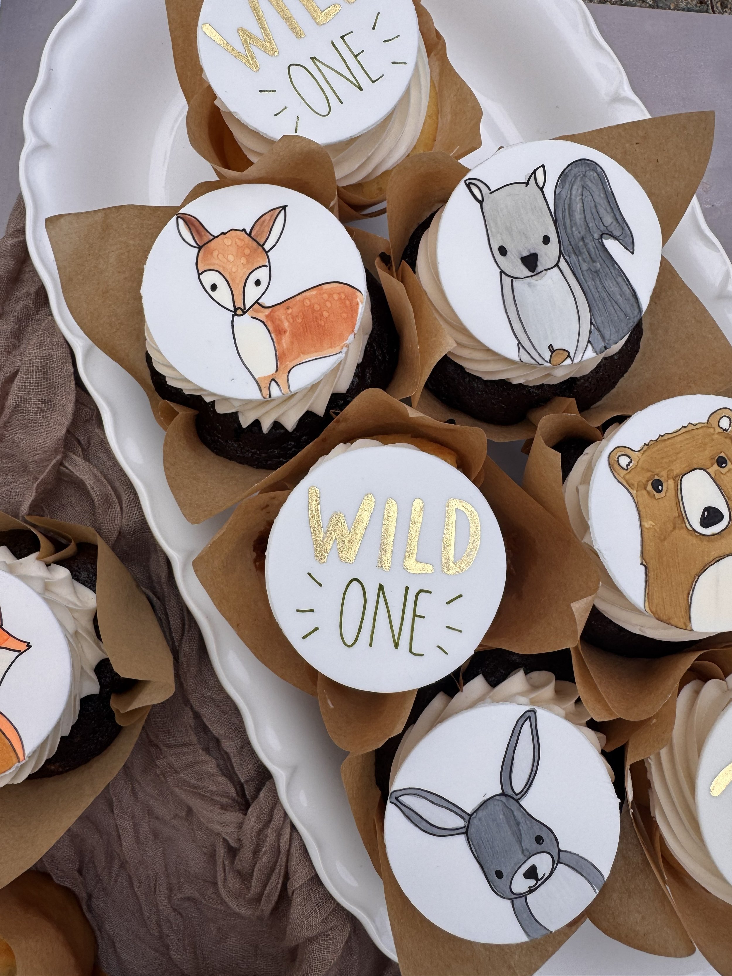 woodland animal forest baby shower cake wild one cupcakes.jpeg