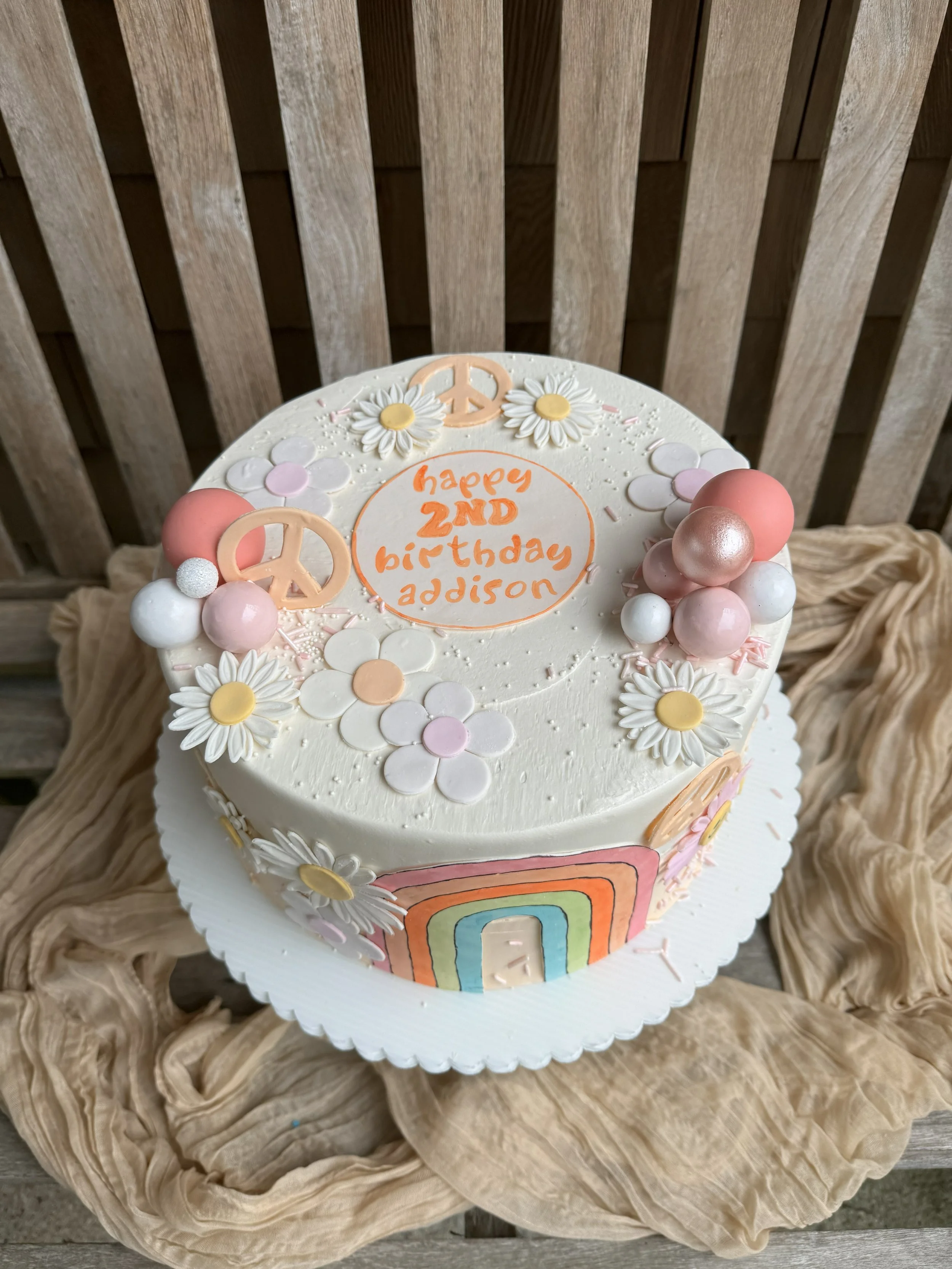 rainbow and flower power groovy peace two cake 70s cake.jpg