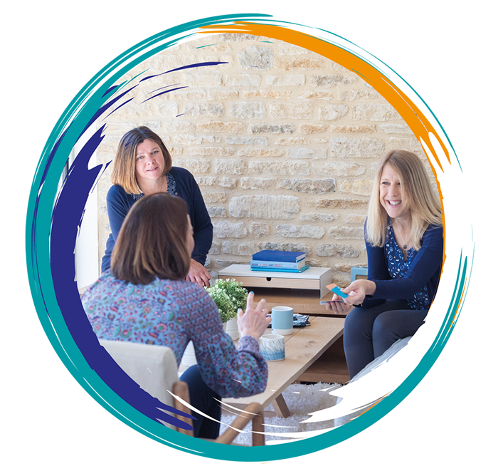 Client conversations over coffee. 3 Women sitting on a sofa