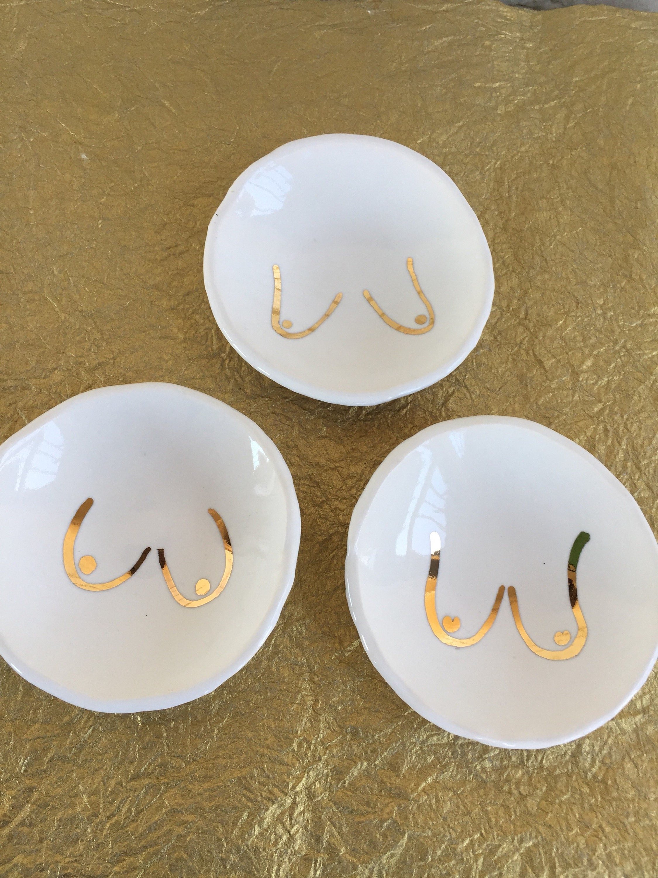 Golden boob trinket dish