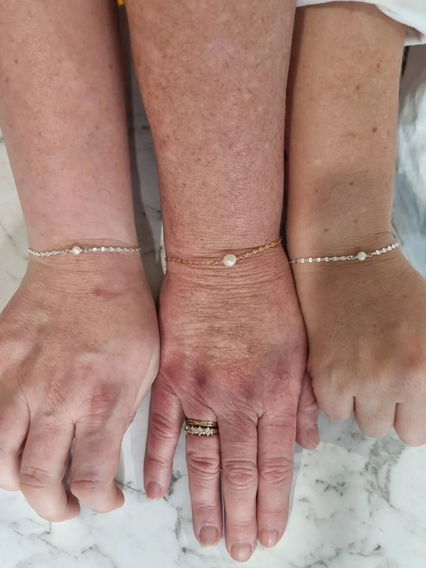Matching permanent bracelets for a lovely mama and her two daughters ✨️

Matching pieces are my absolute favourite to do because they are cute and sentimental ❤️❤️

Featuring pearl connector on Starburst chain.

Private message to book your permanent