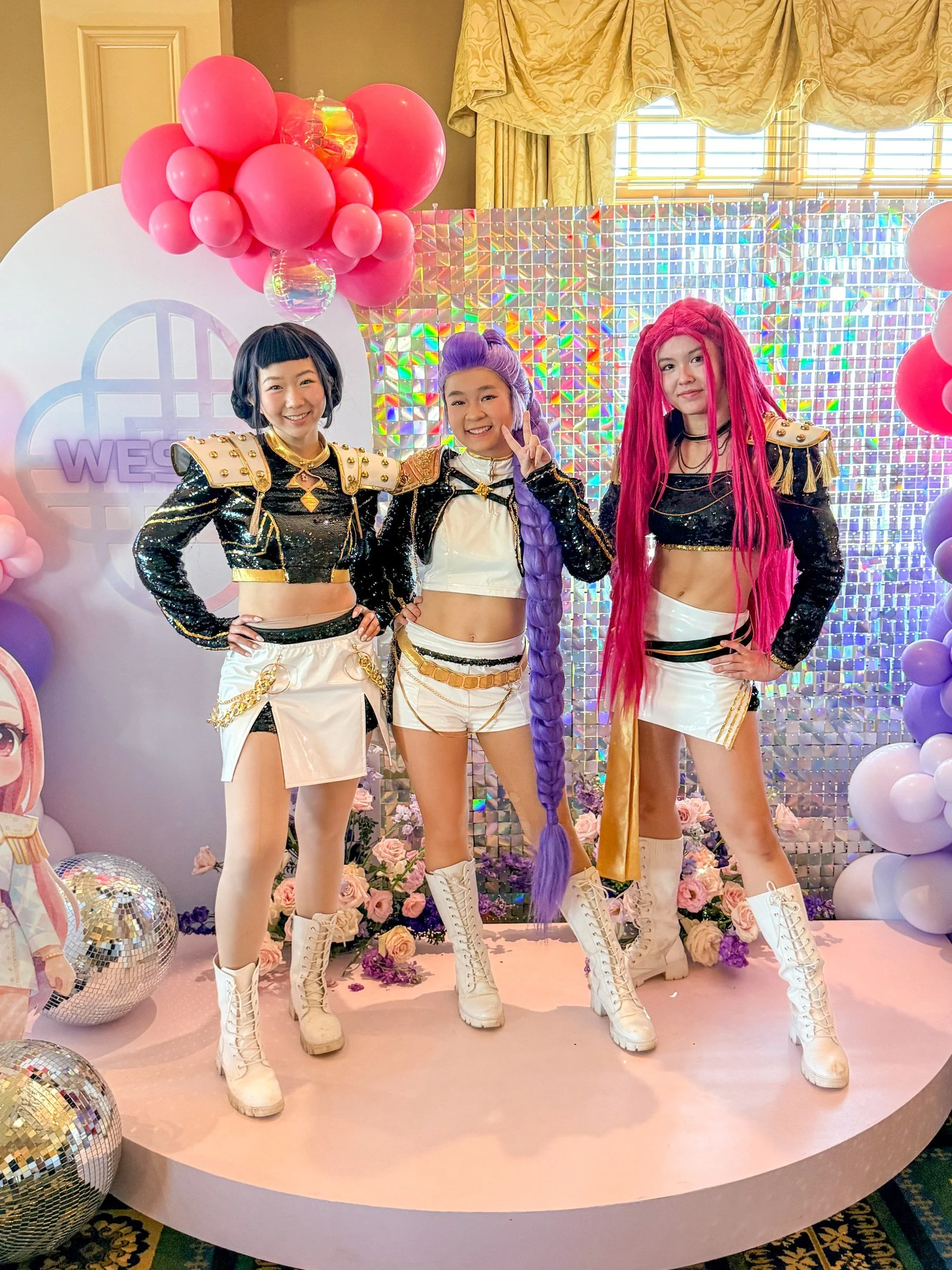 All three K-Pop stars on a round party stage at a birthday in Maryland