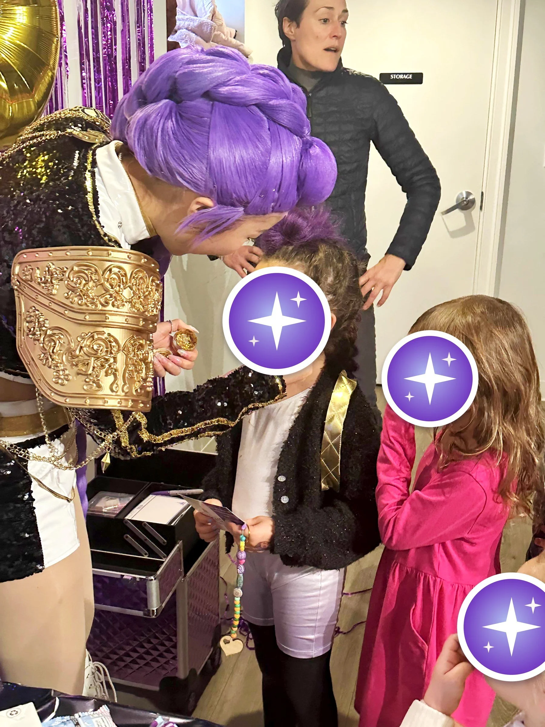 K-Pop star giving a guest a face glitter makeover at a birthday party