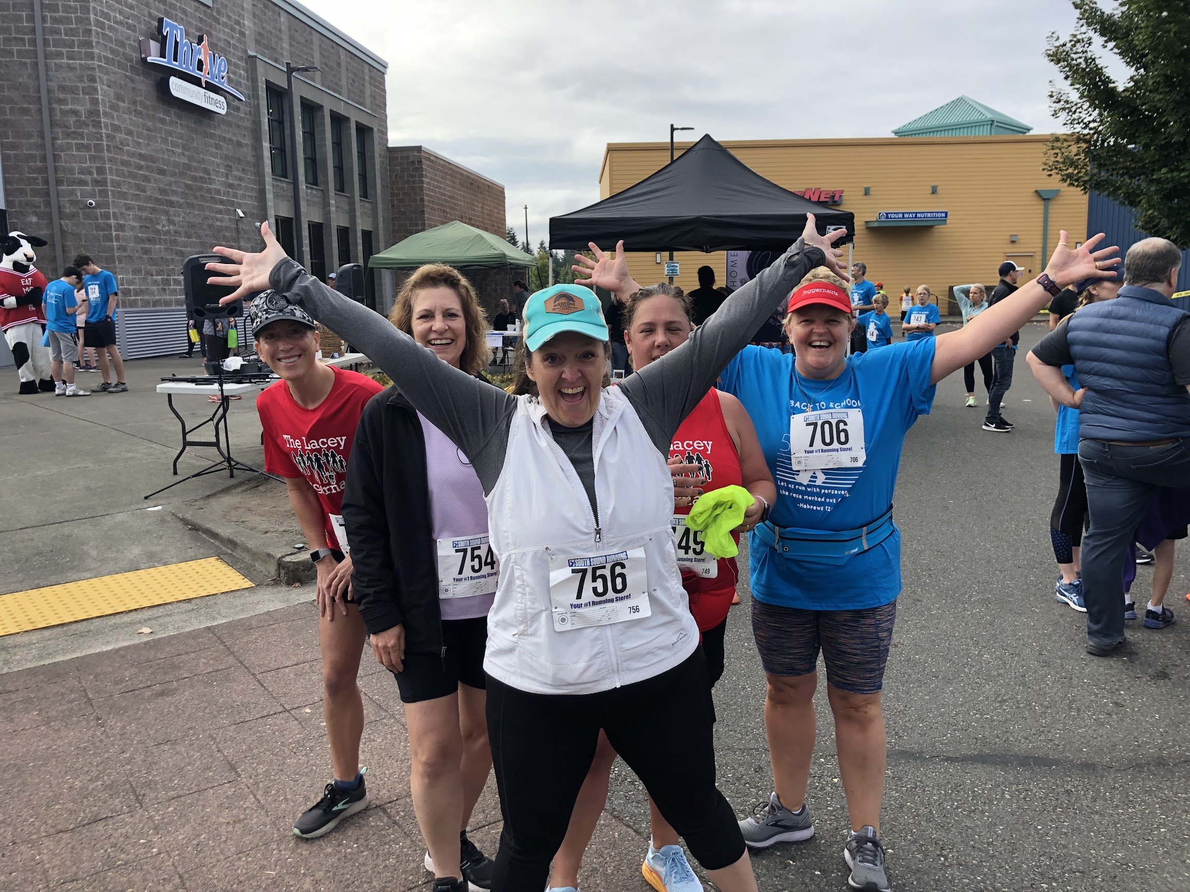 5k group smiling hands raised.jpg