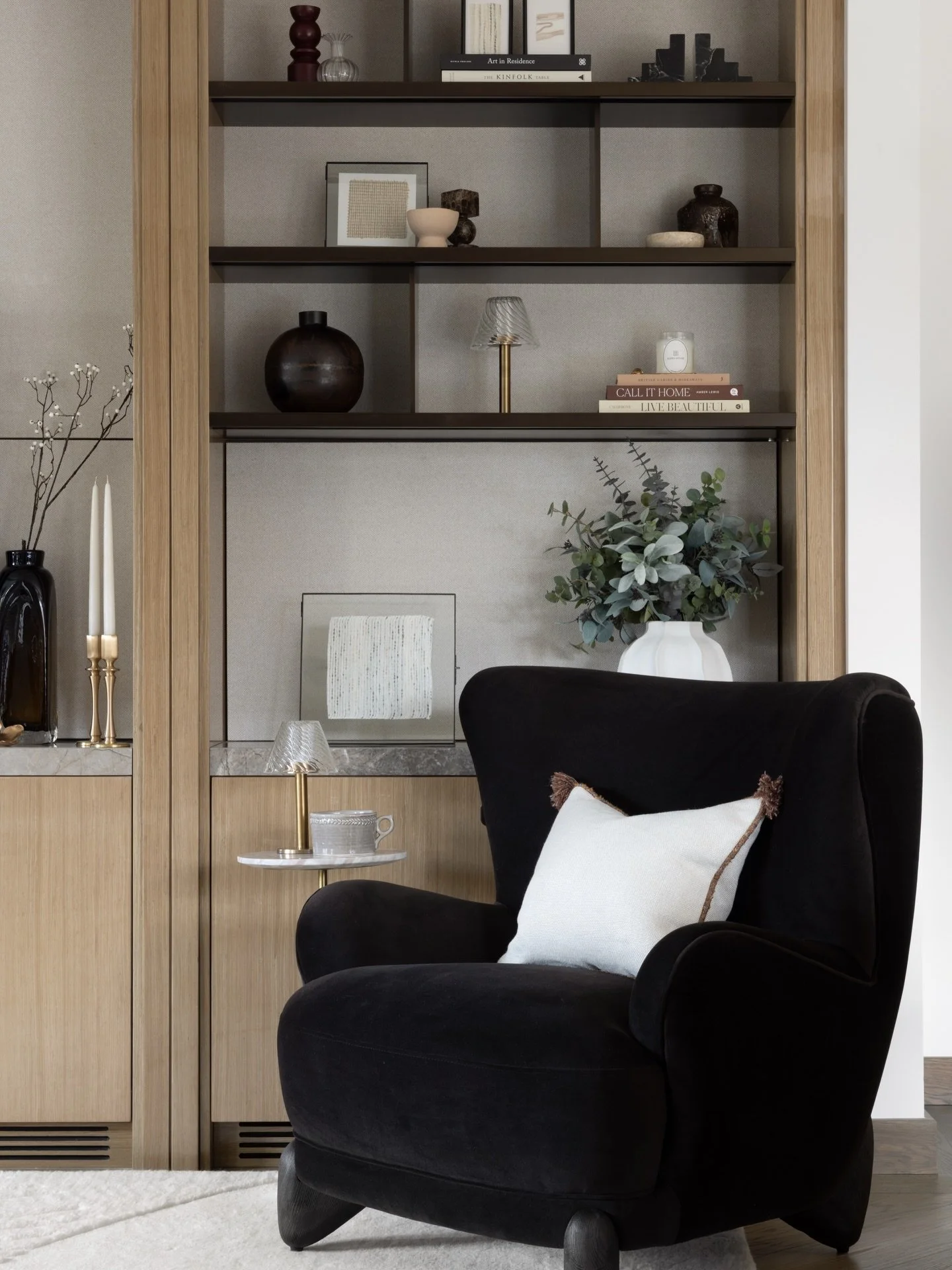 All living spaces need a really comfy armchair in our opinion. 

We favour ones with an interesting silhouette as well as top comfort to create a lovely focal point in the space. The form is especially important when paired with joinery as the softne