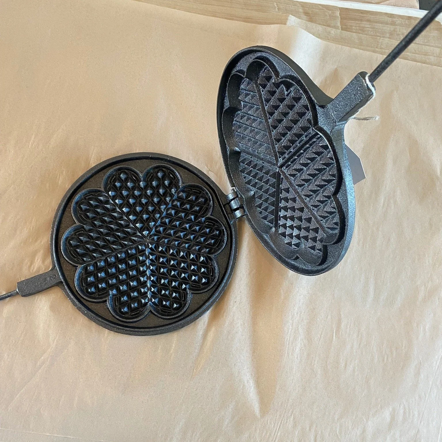 Heart shapes, perfect for the weekend of Valentine's, traditional cast-iron waffle maker works on gas, induction, and electric stovetops.