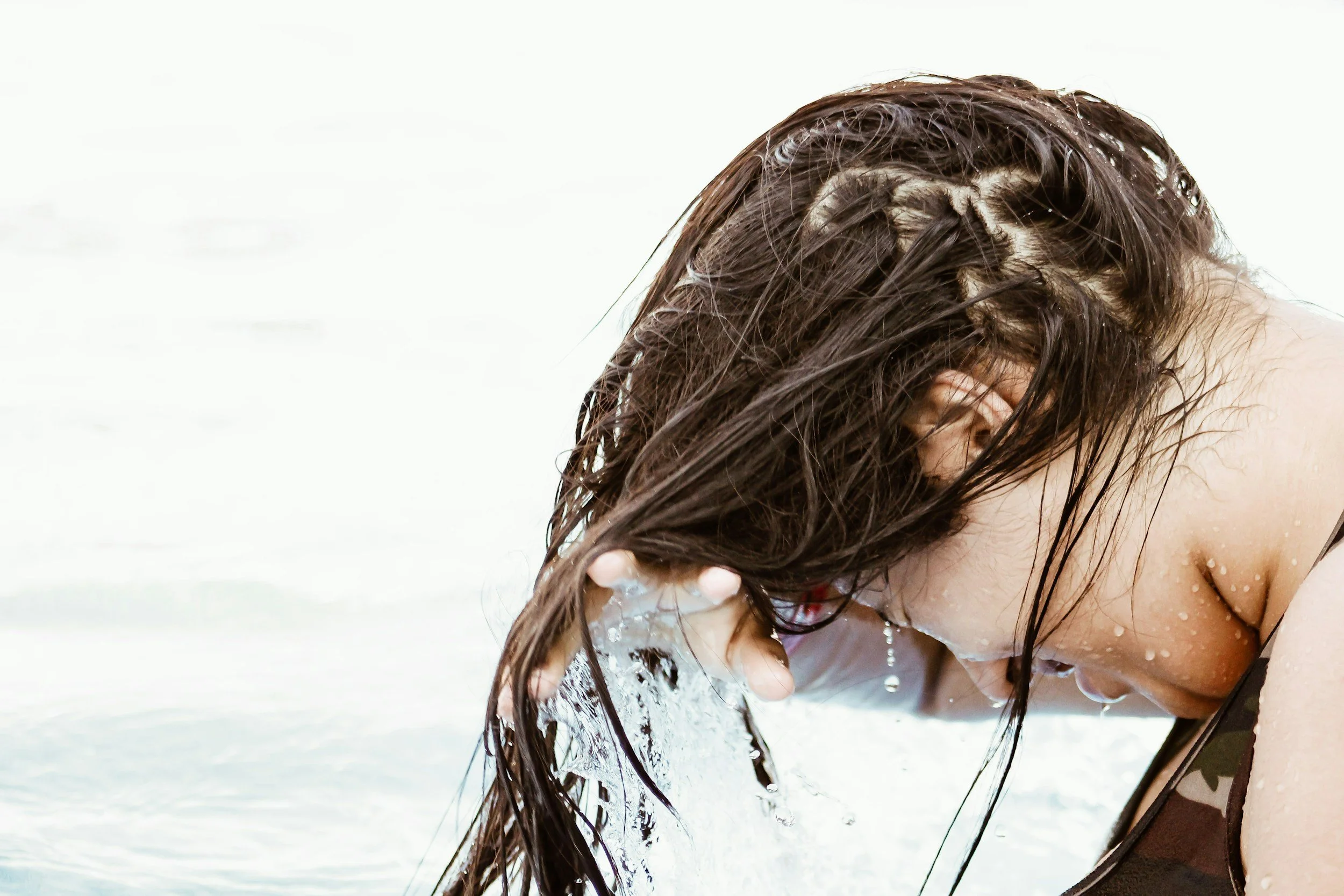 Leave-in conditioner used to protect hair from chlorine and sun exposure