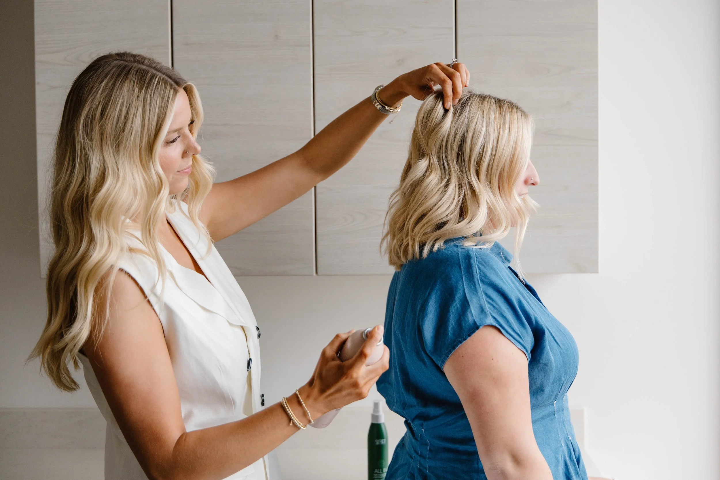 Client getting a holiday blowout and style at a Byron Center hair salon