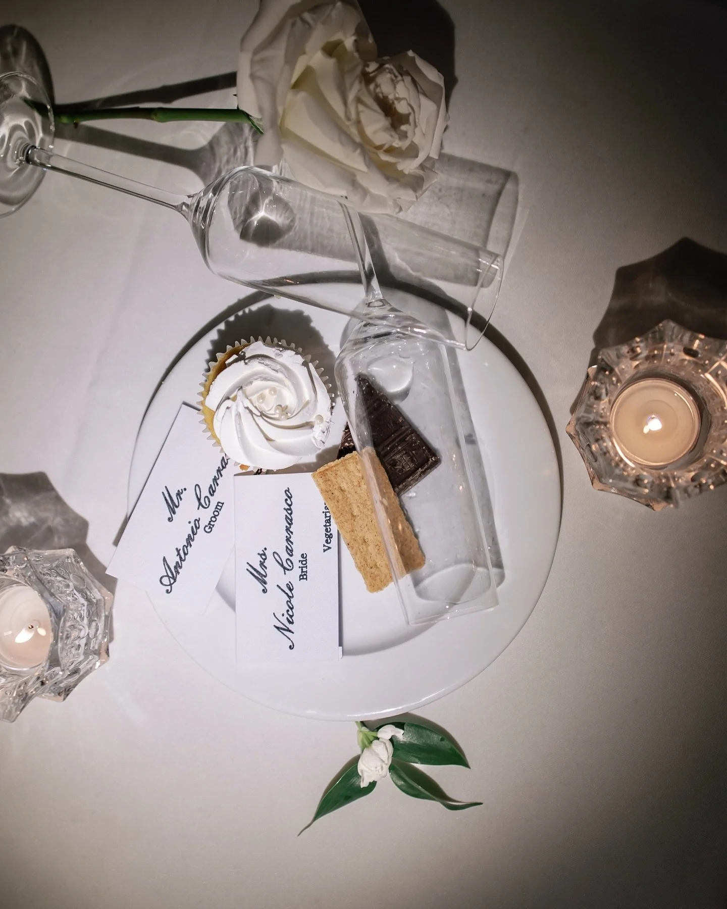 Late-night flat lays are one of Kayla&rsquo;s favorite things to do on wedding days. It allows her to get creative with how to tell the story of the night. An empty glass, a half-eaten dessert, menus and name cards, maybe some shoes and lipstick for 