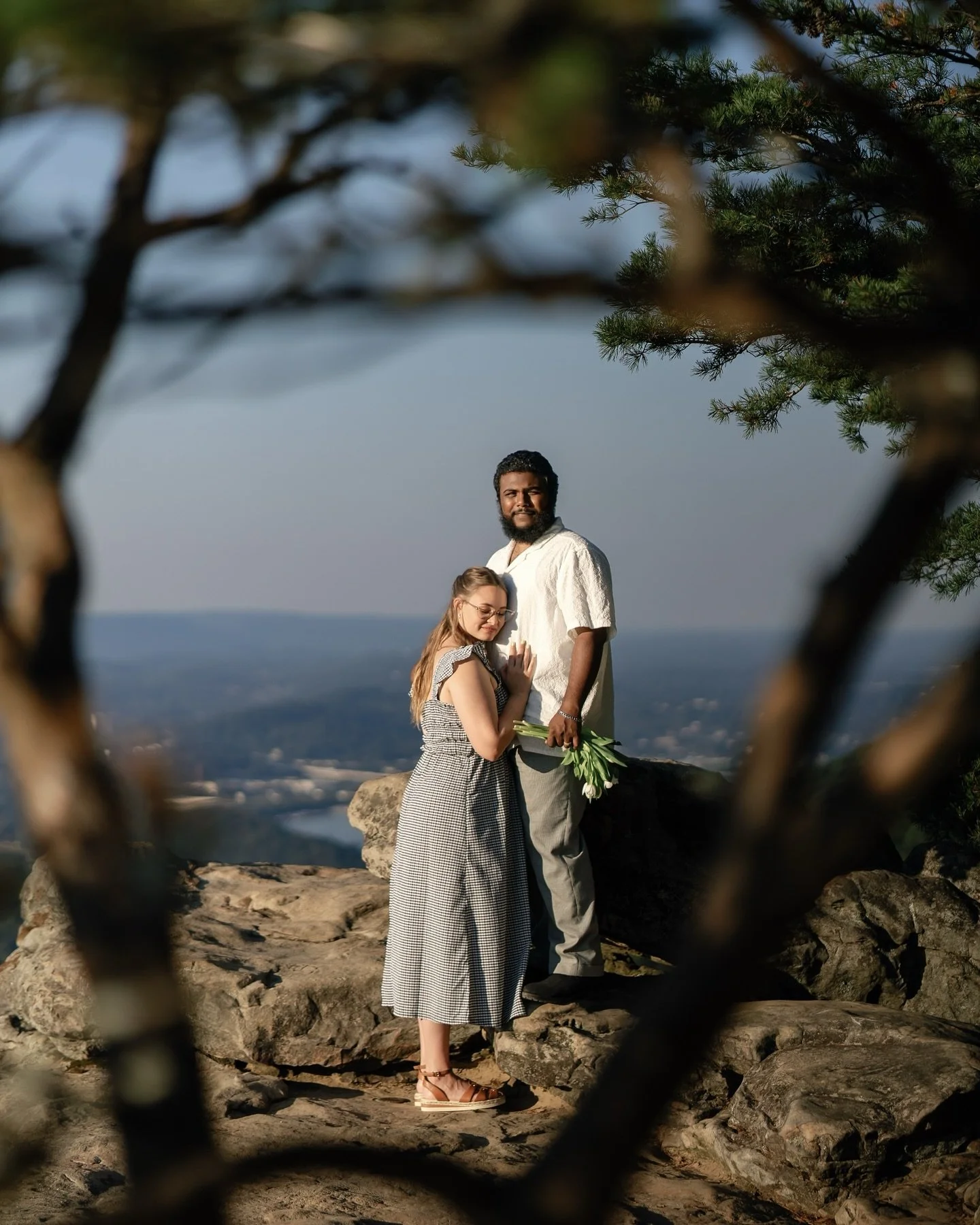 Chattanooga's Sunset Rock is renowned for its breathtaking views. Every evening, people flock to the ridge to take in the vistas at dusk. When Hannah and Matthew shared their dream of having engagement photos taken atop the rock, we knew we had to ma