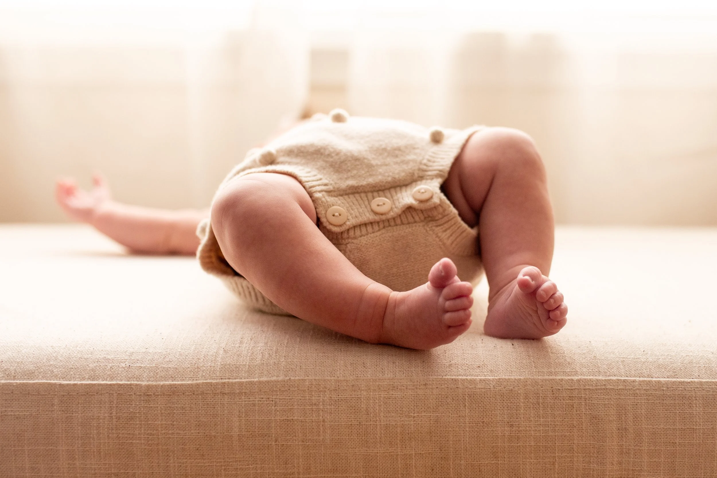 2 Month old baby feet in natural light studio in downtown Bozeman, MT. Wanderbirth Photo, Mikaela DiBerardinis