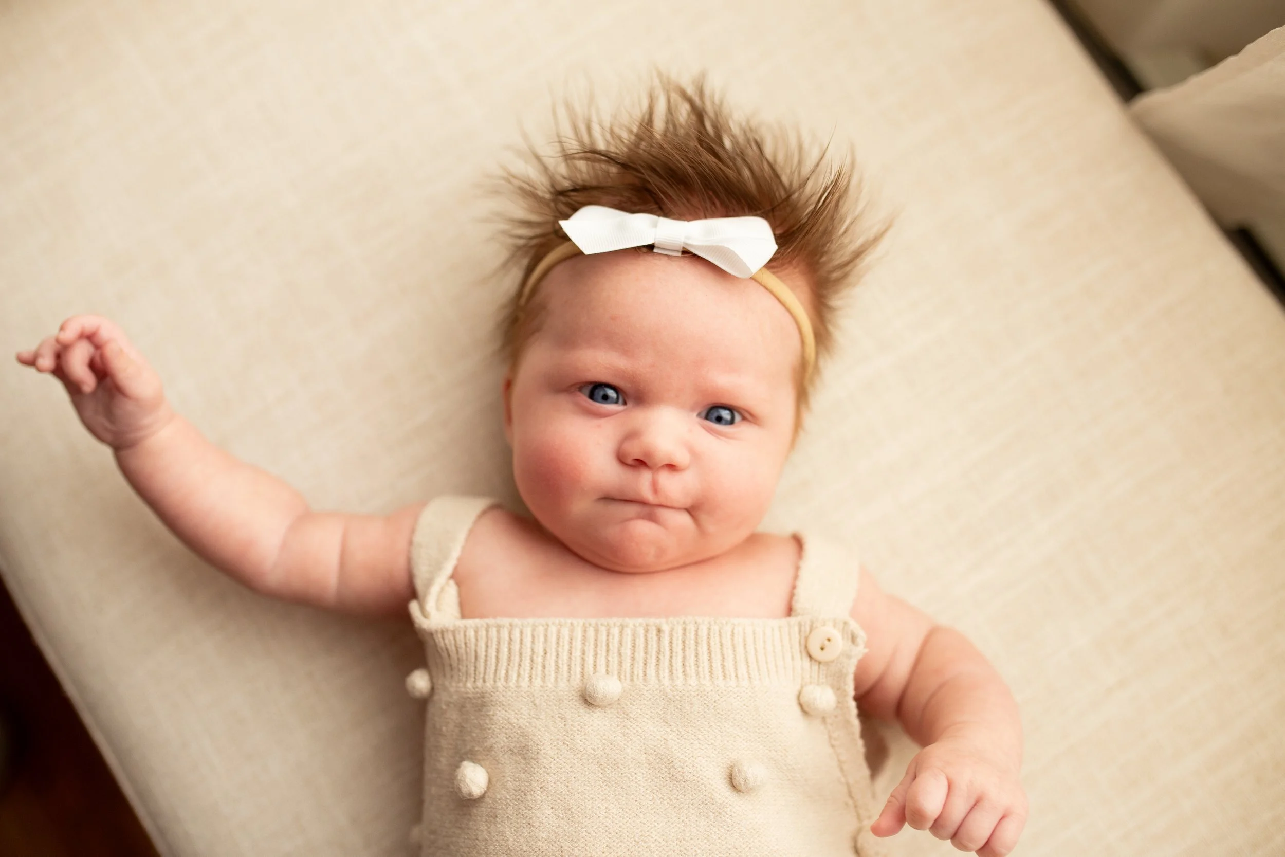 2 Month old baby smiles for the camera in natural light studio in downtown Bozeman, MT. Wanderbirth Photo, Mikaela DiBerardinis