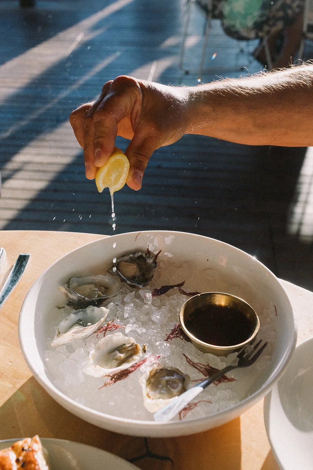 oysters and lemon on display at Meriman's restaurant, Maui, Hawaii by Daeja Fallas for Travel and Leisure