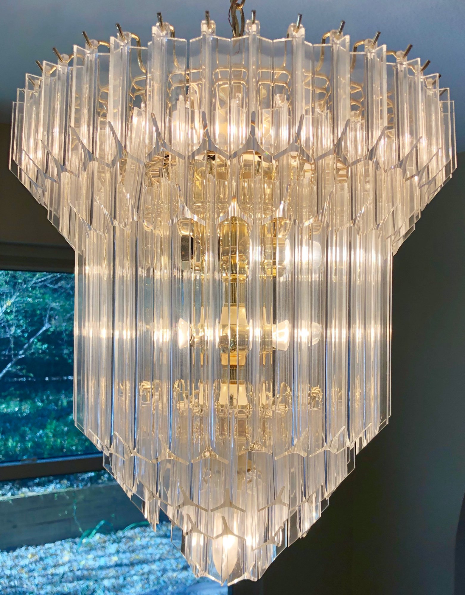Chic 1970s Lucite Prism Chandelier with brass plate cage.
Dimensions: 22" tall x 18" wide
Price: $2,400