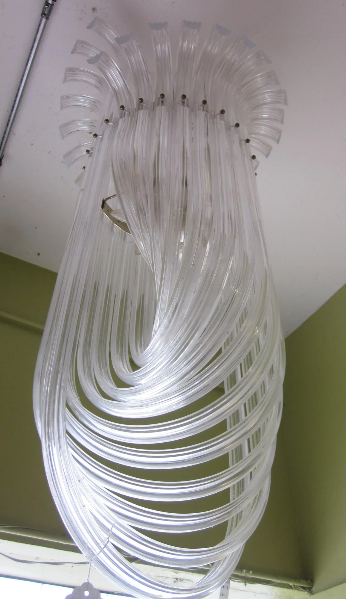 Outstanding large 1970s lucite rope shape chandelier with chrome cage.
Dimensions: 25" Wide x 46" High
Price: $3,700