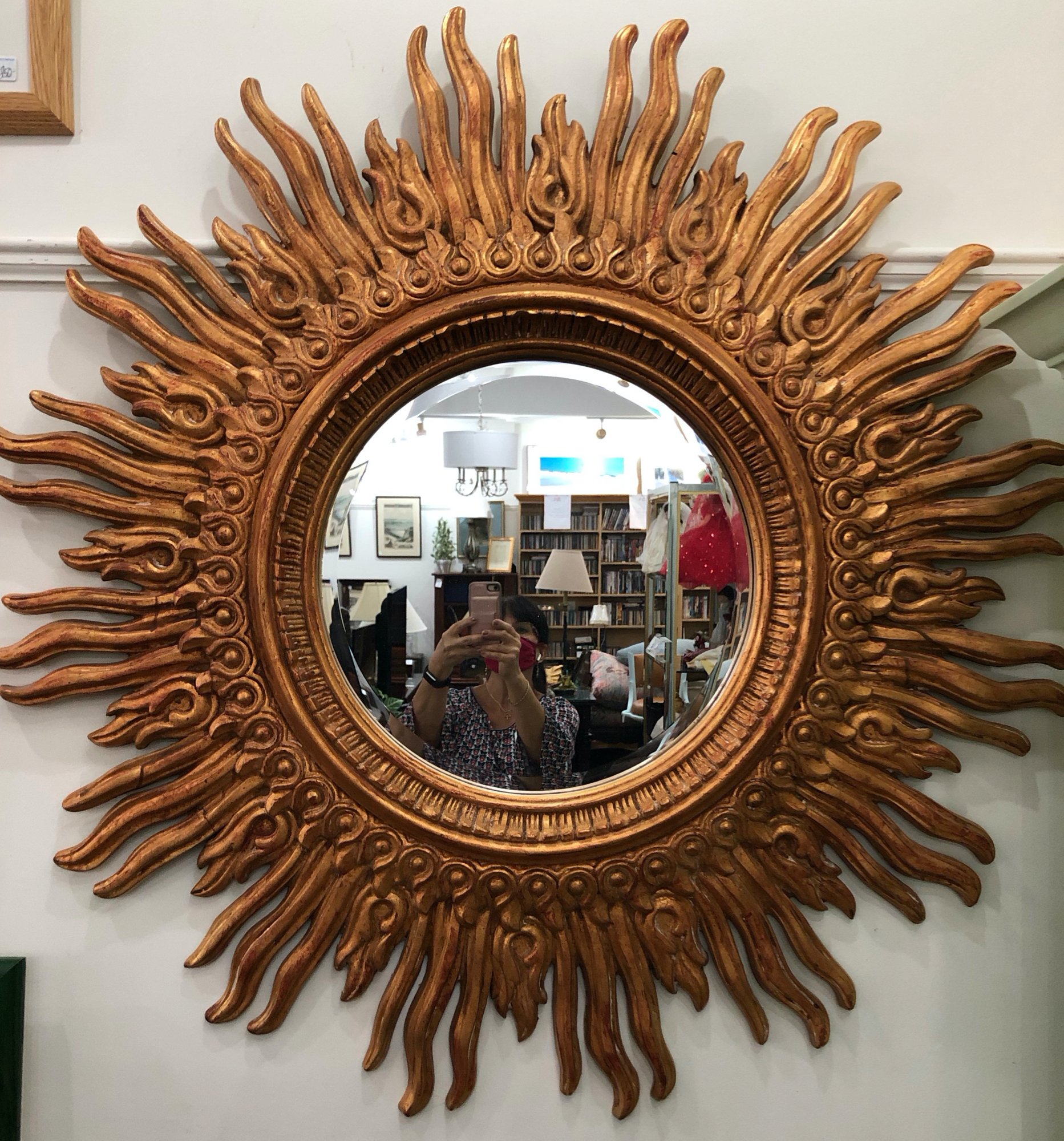 Chic large mid century Syroco starburst mirror. Dimensions: 47" in diameter Price: $2,100