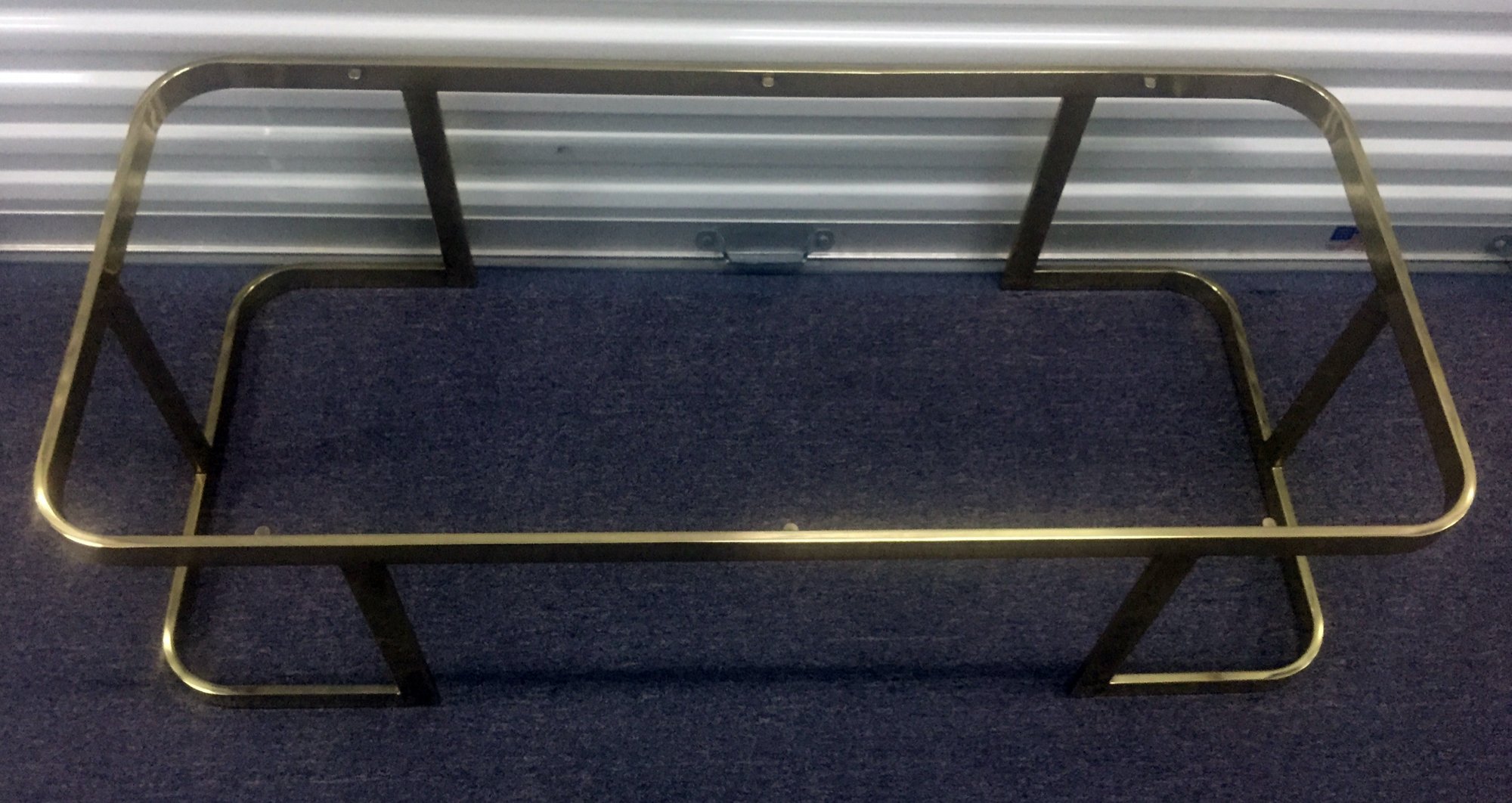 Chic American 1970s brass plated modern coffee table with glass top.
50" wide x 23" deep x 16" high
SOLD