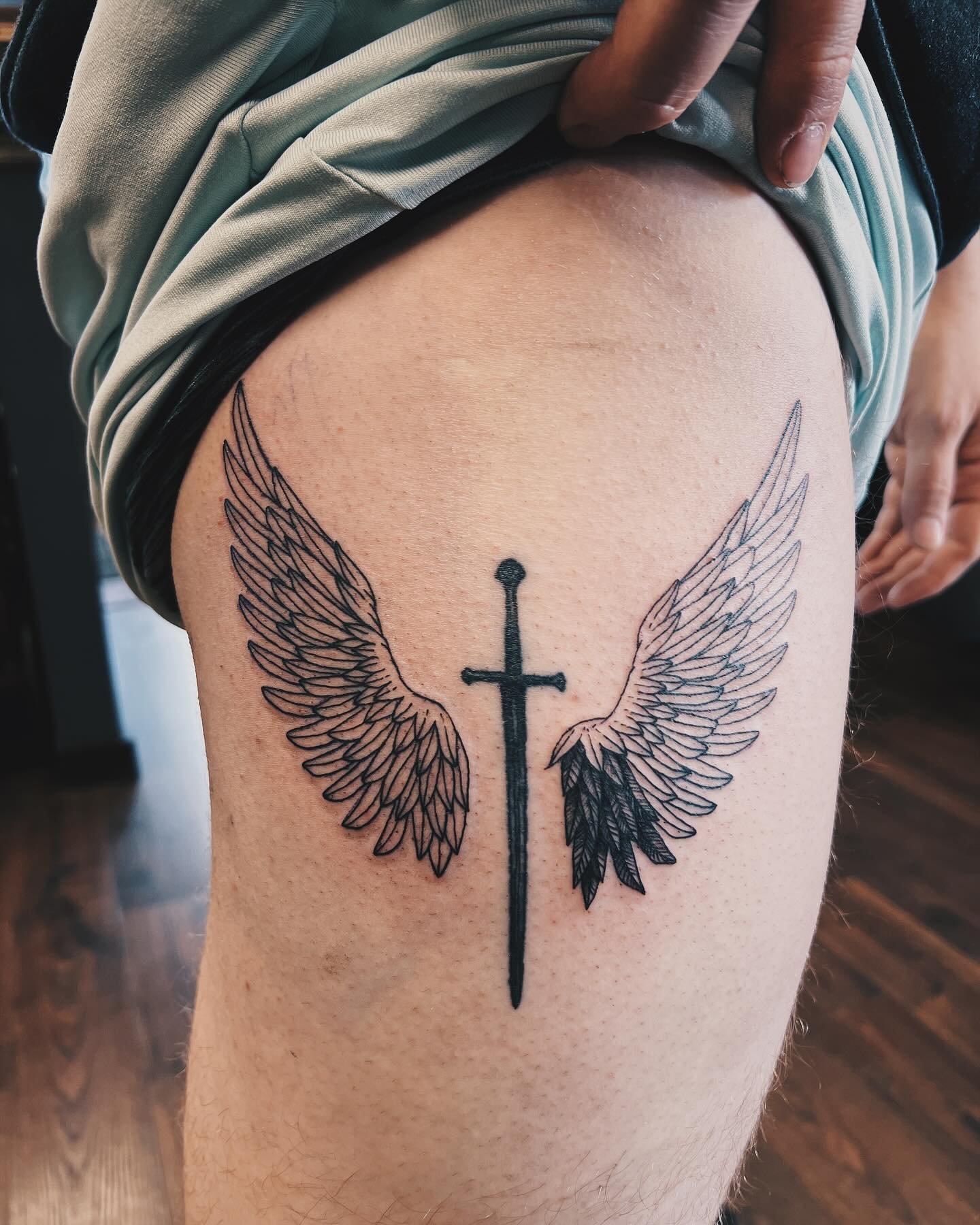 Sword for the husband @nickfriendt was second tattoo I did on another person and yesterday we got to start on the wings he wanted on the left/right of it. :)
.
#narsil #swordtattoo #angelwingstattoo #learning #growing #tattooapprentice