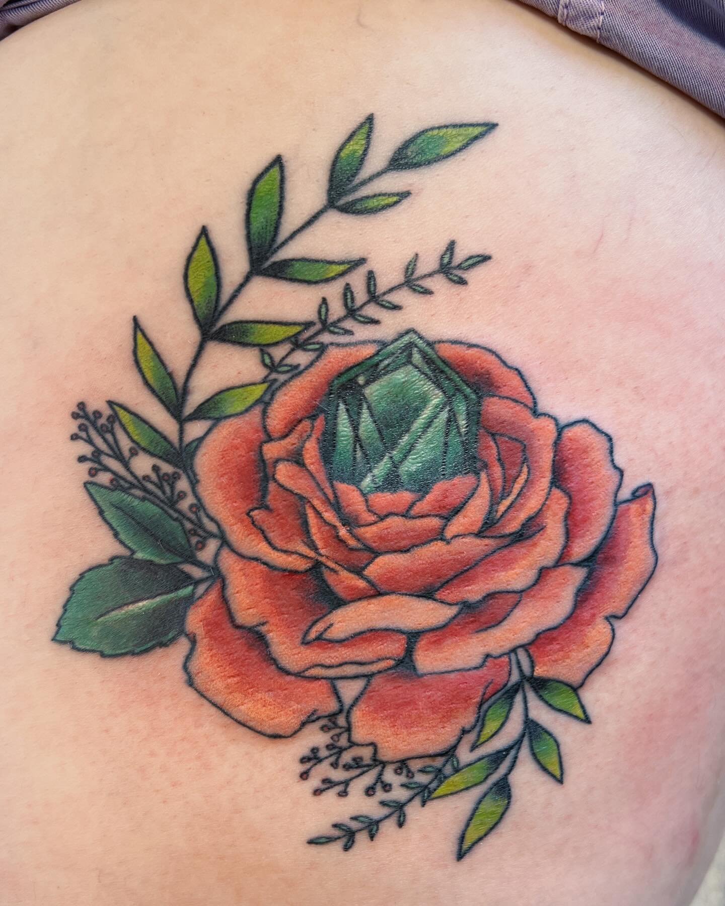 Color blending practice on sis @honey_bree31!! 😍 Got to finish her coral peony and emerald. I really love these colors. Color blending is hard. 
.
#peonytattoo #emeraldtattoo #gemtattoo #tattooapprentice #learning #growing