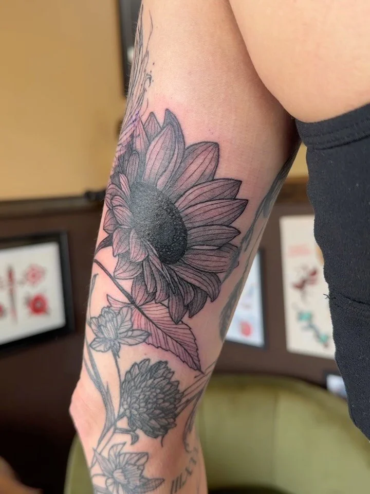 Made some progress on Beth&rsquo;s sleeve too this week! We added her sunflower and shaded half of her phoenix, and added some feather filler too down by her wrist
🐦&zwj;🔥🌻🪶🔥
.
#minnesota #minneapolis #tattoo #phoenjx #sunflower
