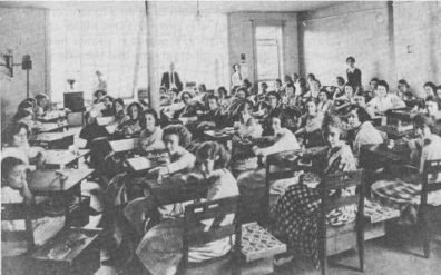 Girls line up inside a watch painting factory to complete their daily dose of watch faces and radium ingestion.