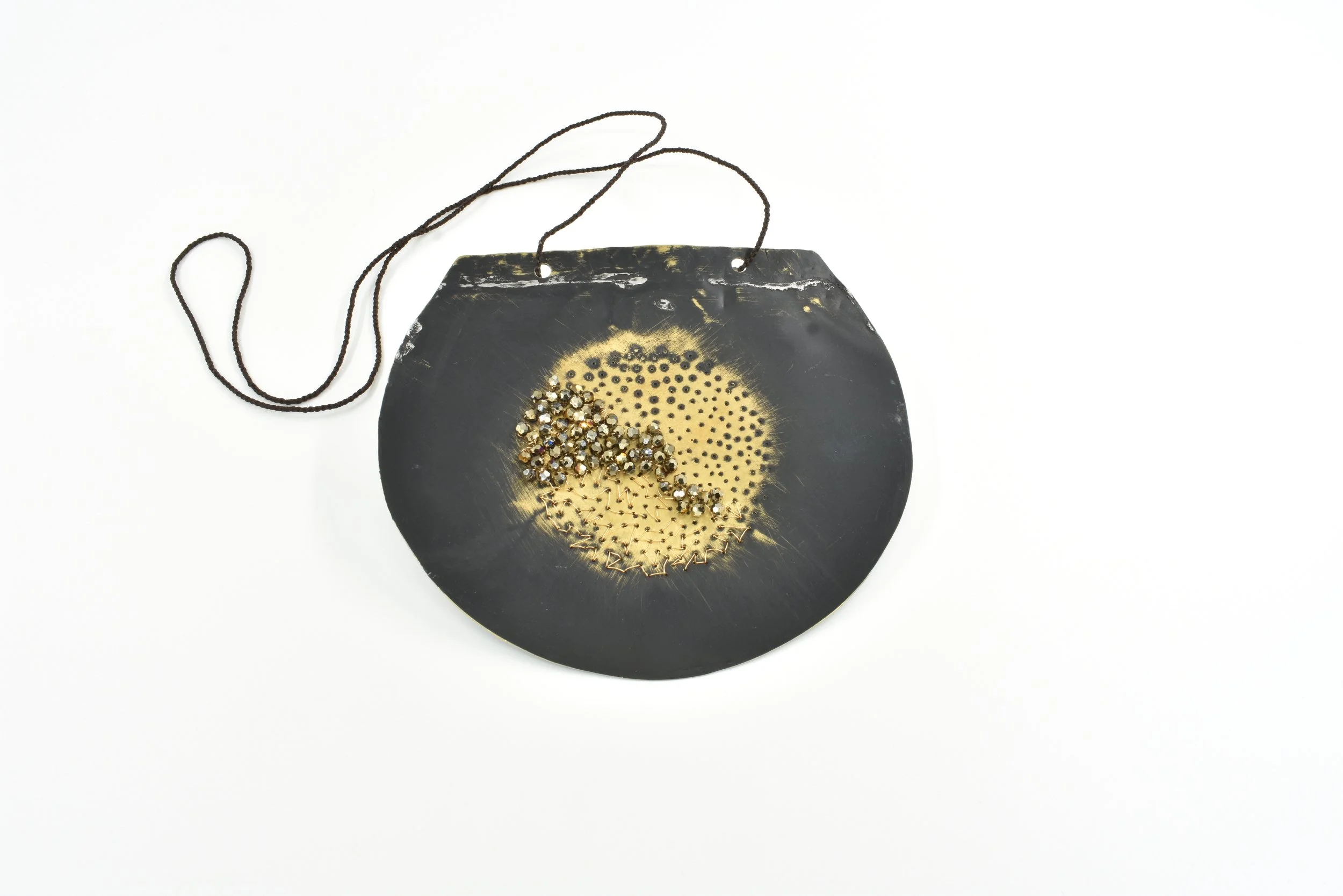 Big Bang (2024) repurposed brass sheet, Swarovski crystal beads, vintage seed pearls, silk thread, brass wire, sterling silver, paint, hand-woven waxed cotton cord
