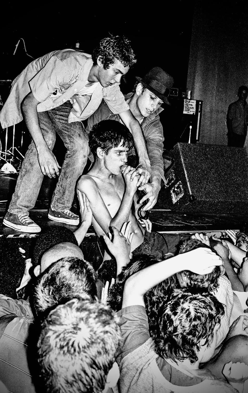  Tony Adolescent with his friends Mike Ness of Social Distortion and "Simo" working the stage, early 80s. Photograph by Edward Colver. 