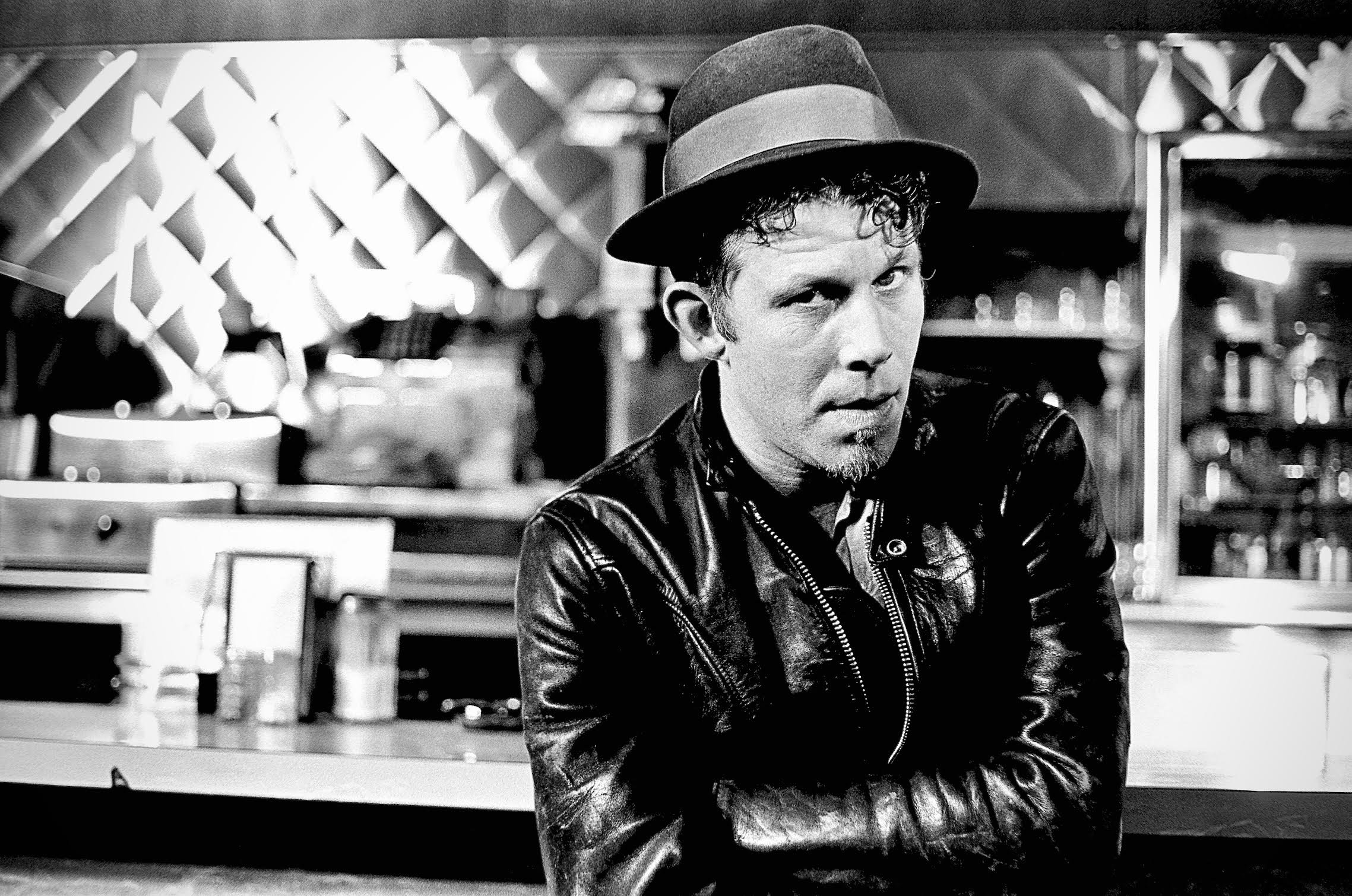  Tom Waits, photographed in the Travelers Cafe, Los Angeles, CA, 1985. Photograph by Edward Colver. 