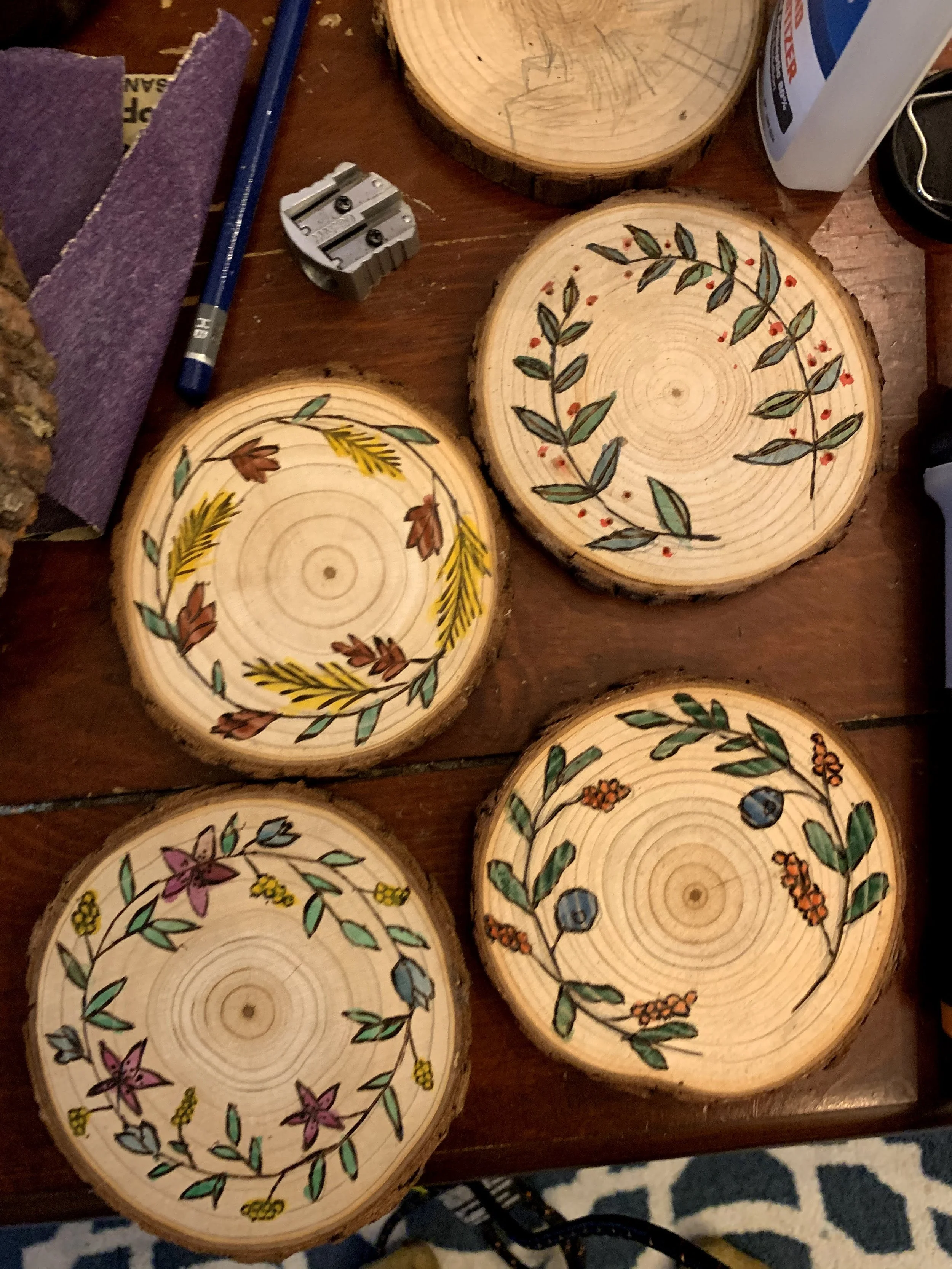 Watercolor and wood burning. 