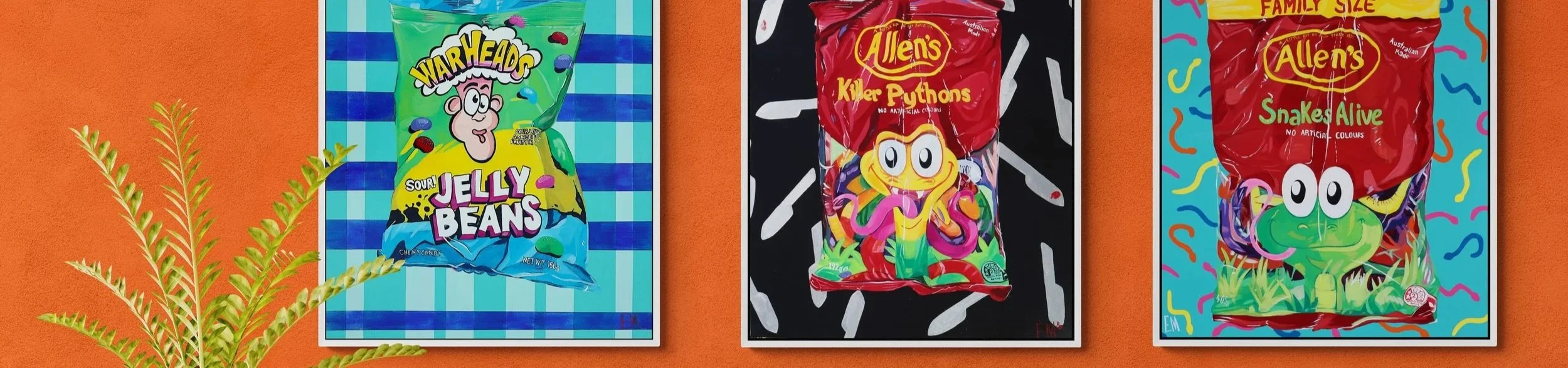 3 statement lolly paintings hang on a wall