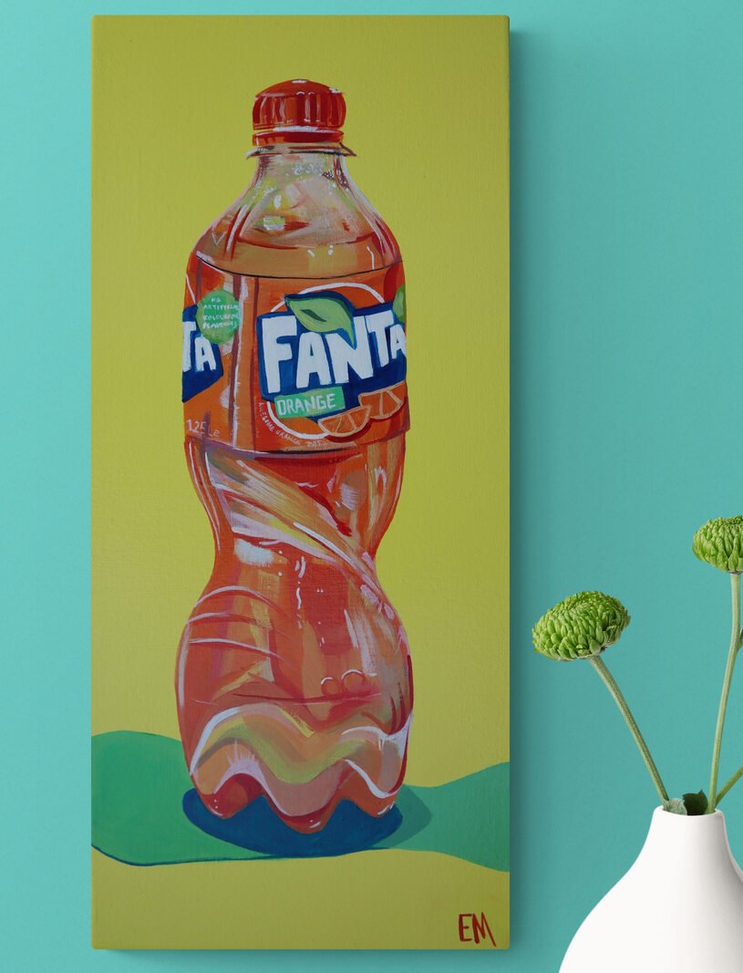 fanta painting hanging on light blue wall