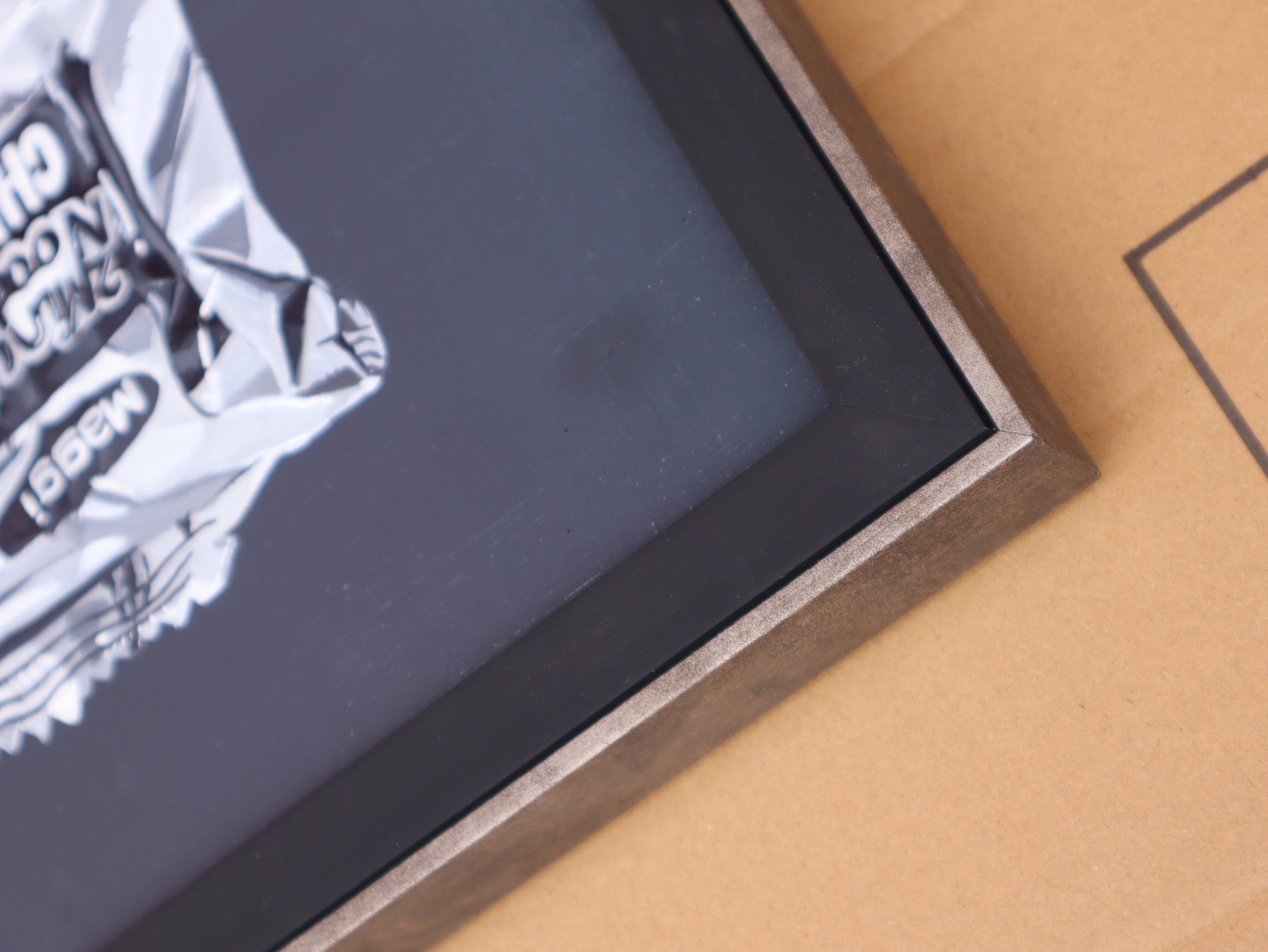 detail of black silver frame on art