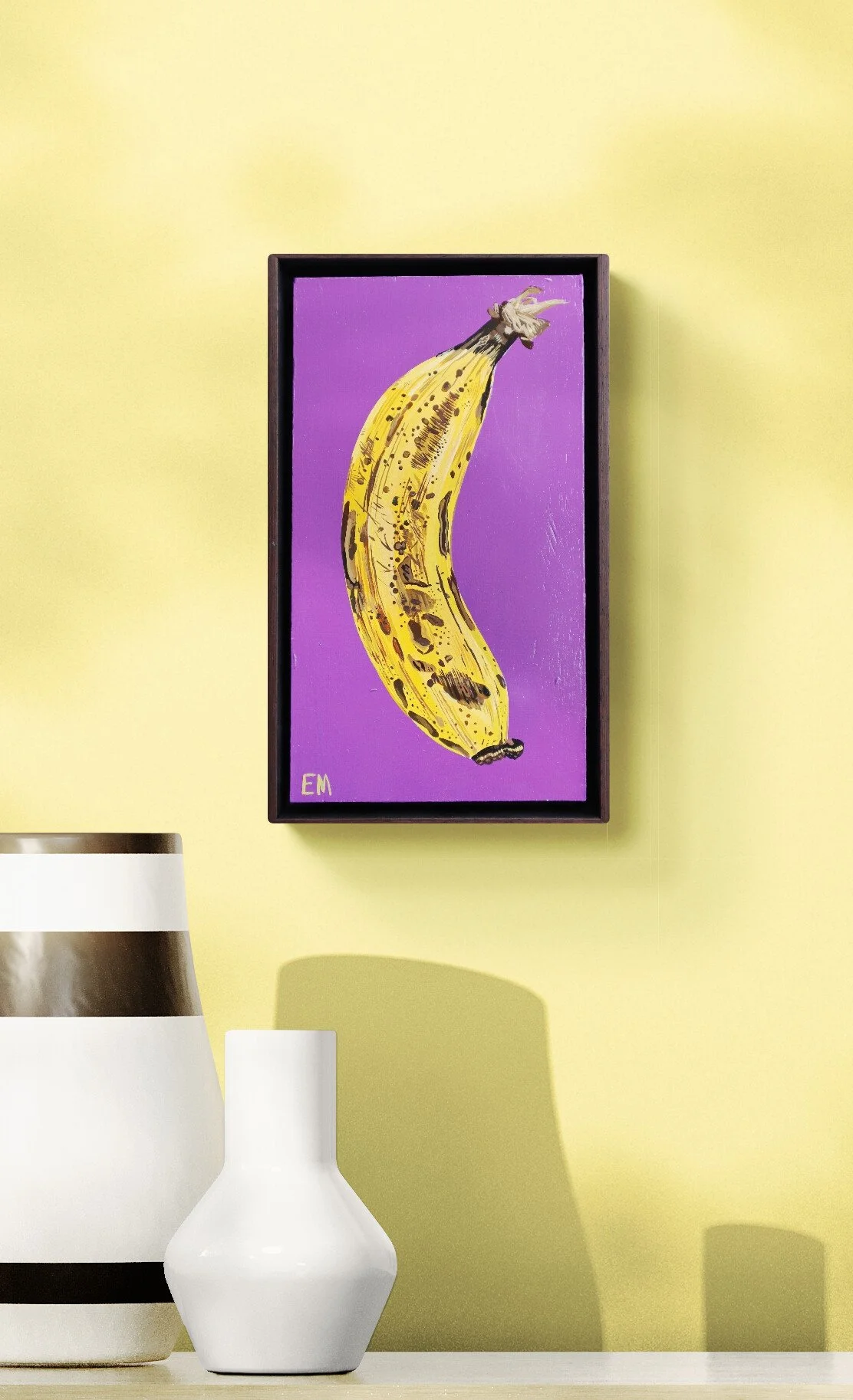 banana painting hanging on yellow wall