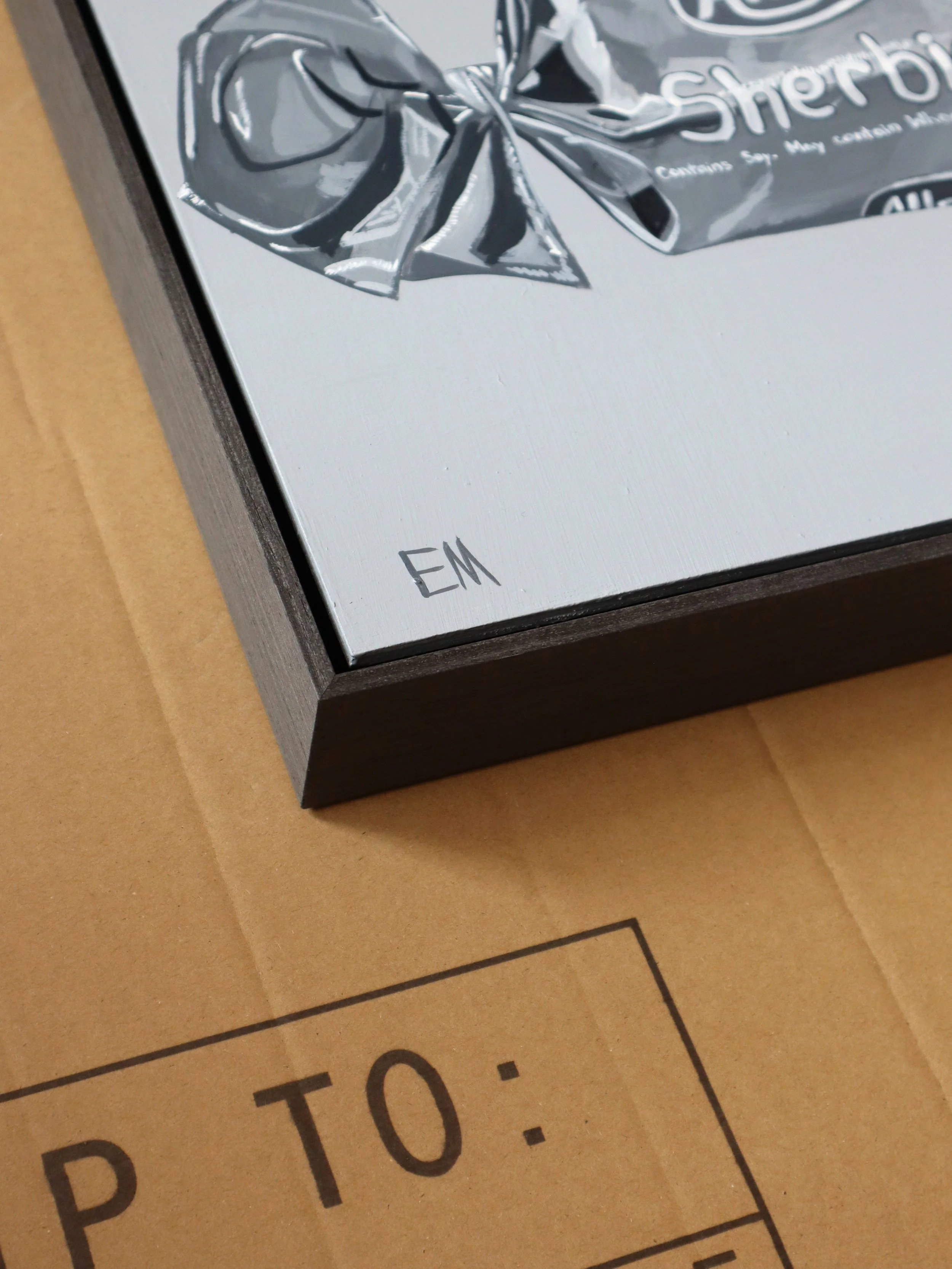 Detail of Grey Box Frame against a grey painting