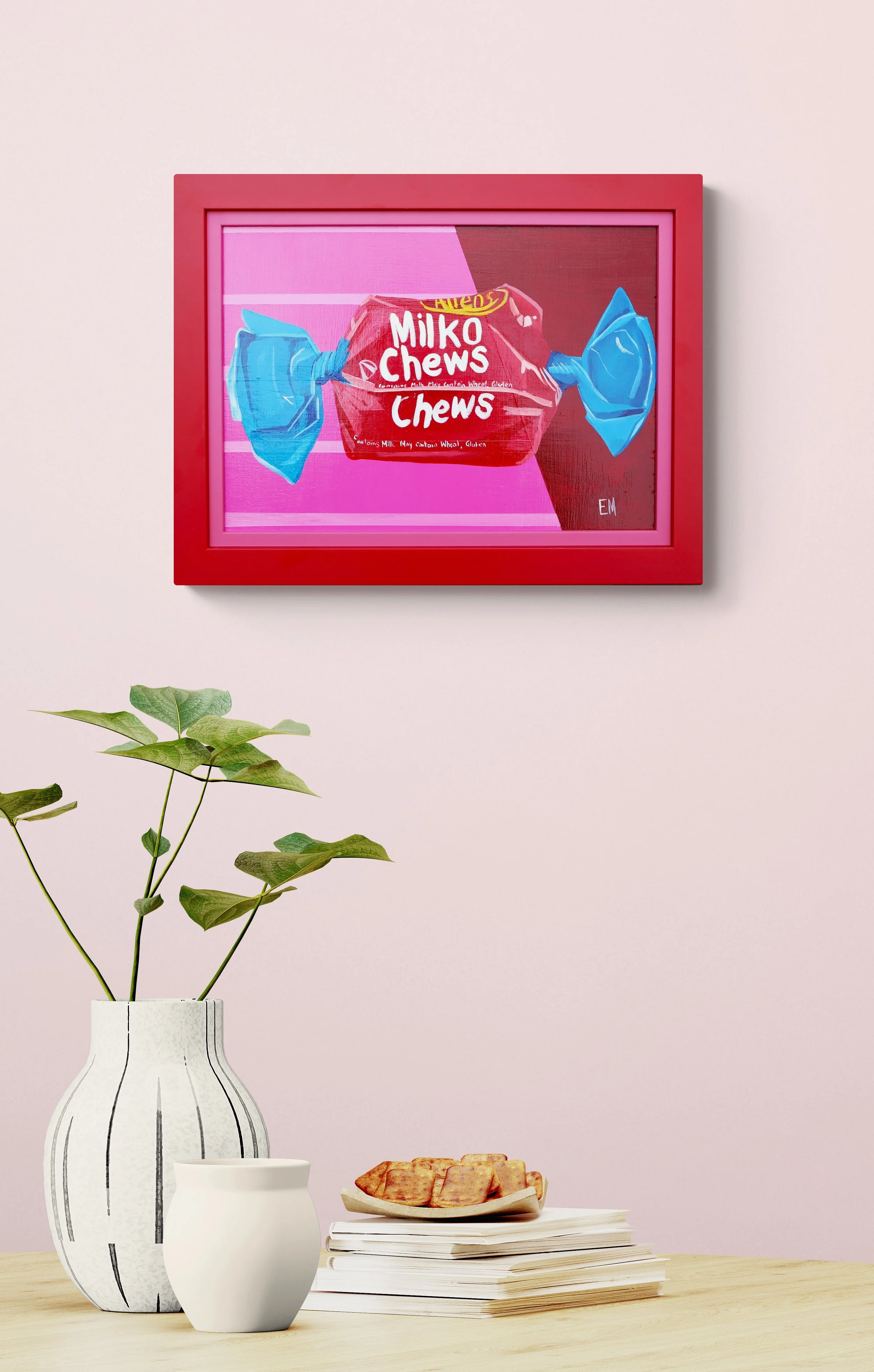 red and pink painting milko chew hanging on wall