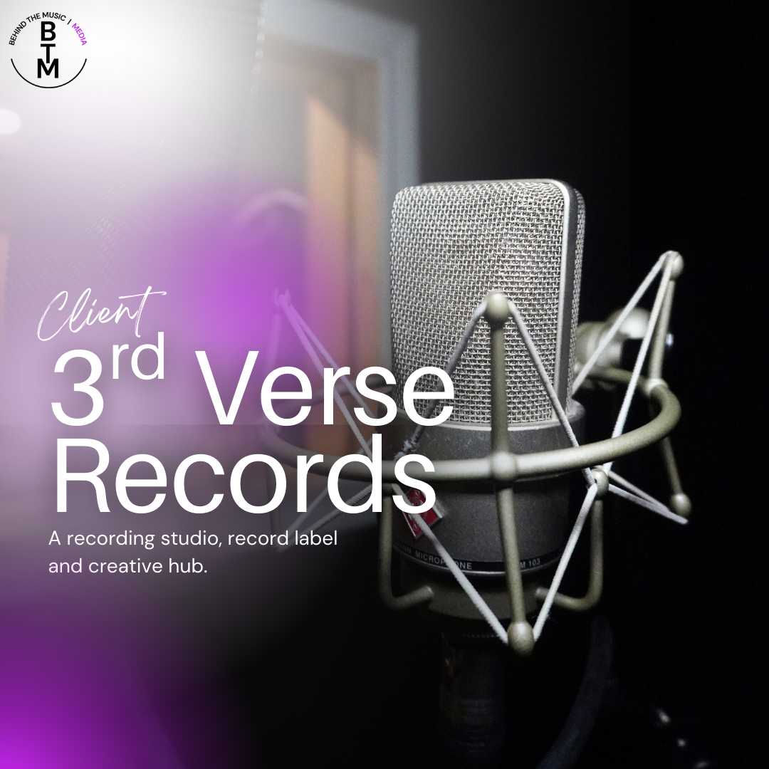 Close-up of a professional studio microphone in a recording booth, with soundproof walls and recording equipment in the background.