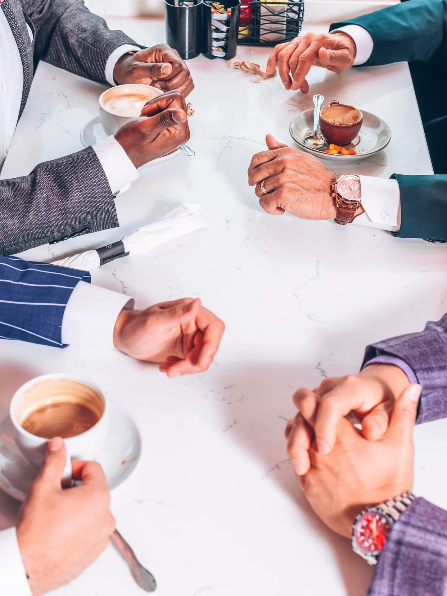Hands on coffee cups, cuff links catching the morning light, quiet conversation before the day begins.

This season&rsquo;s story unfolds in the joy of the everyday&mdash;proving that great style isn&rsquo;t about where you go, but how you show up.

