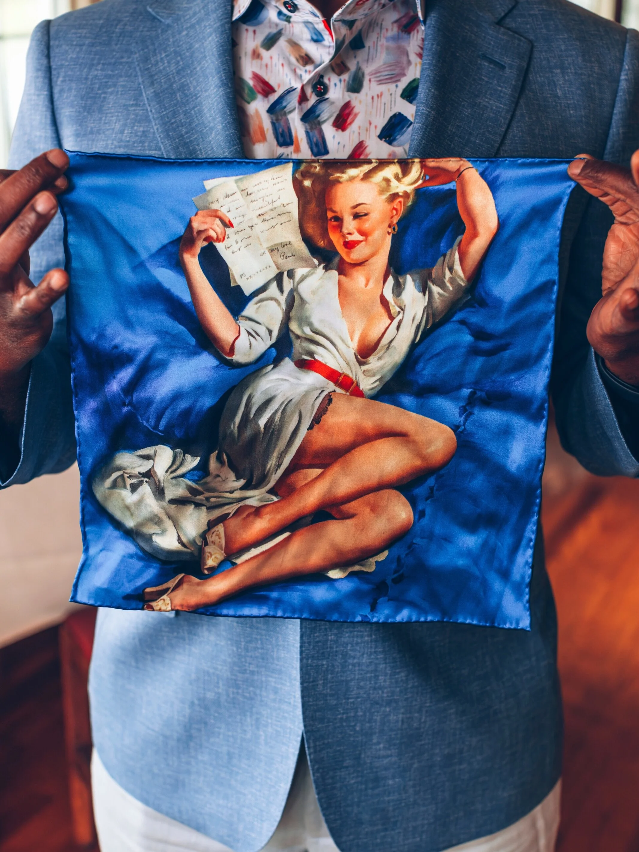 She&rsquo;s been turning heads since 1947, and now she&rsquo;s doing it from your breast pocket.

Gil Elvgren&rsquo;s &ldquo;He Thinks I&rsquo;m Too Good to Be True&rdquo; is one of the most iconic images in American pin-up history. 

Known for his g