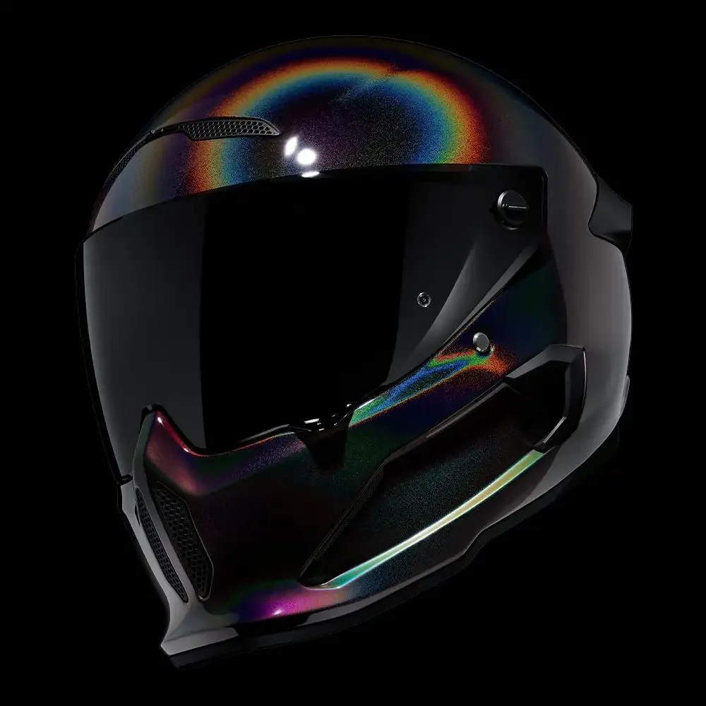 A black full-face motorcycle helmet with multicolored reflective accents on a black background.