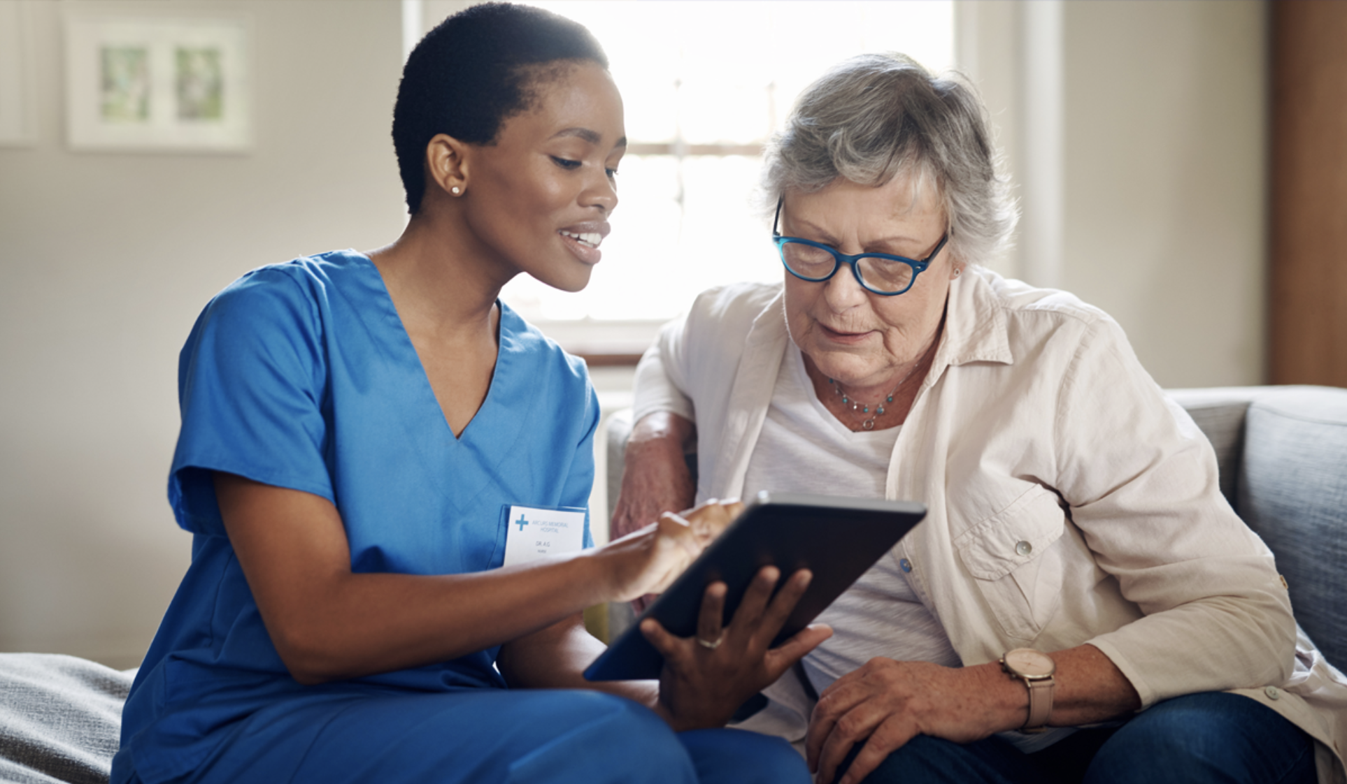 Universal Key Solutions home care coordinator using a secure tablet interface to verify medical discharge protocols and certified environmental accessibility modifications for an elderly patient.