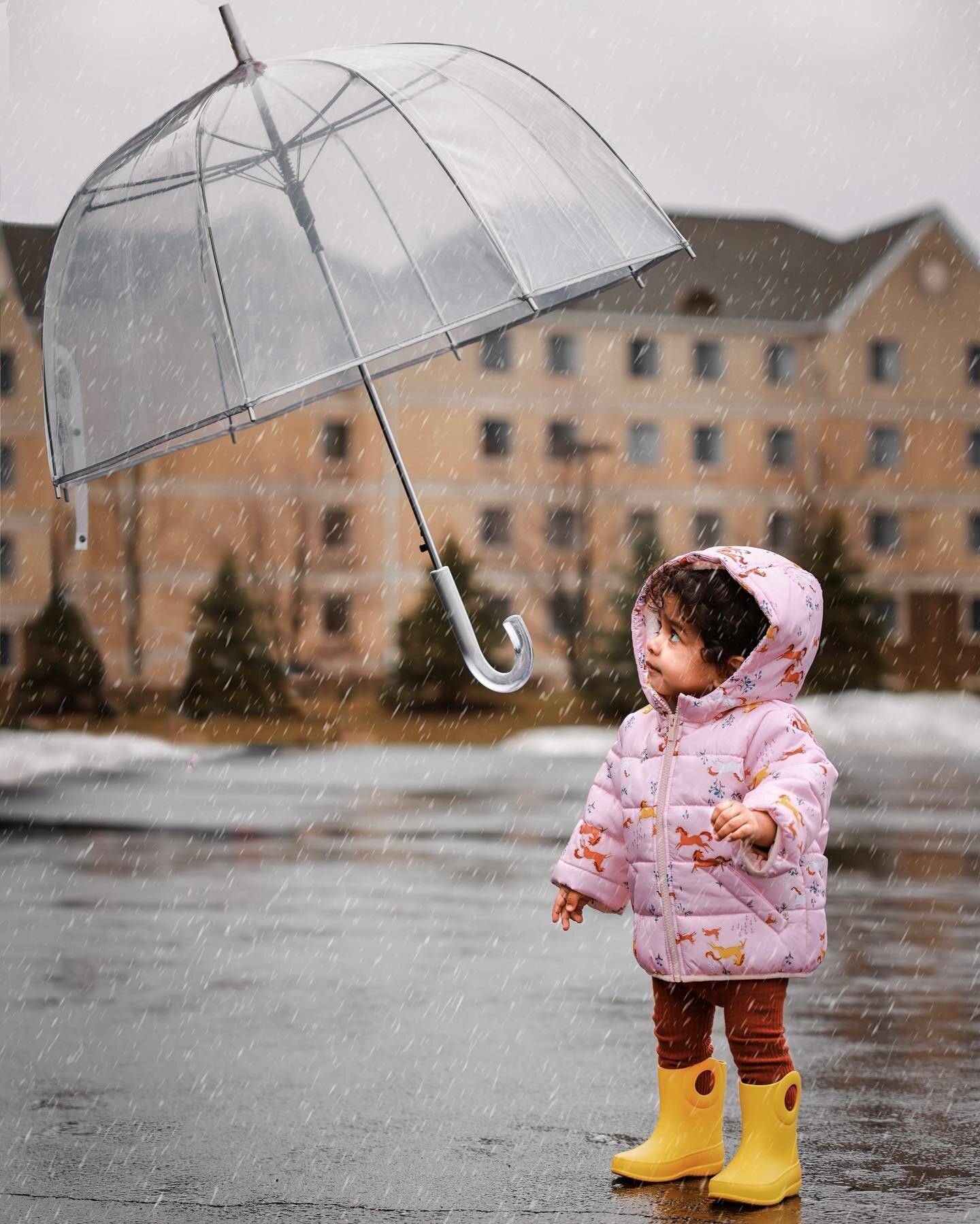 We tried to make it a day out of the rainy day yesterday. It was warmer initially so we got out with our rain boots and umbrellas and paper boats. 

We ran, we splashed, we fell in the puddles, we ruined our paper boats within a couple of minutes but