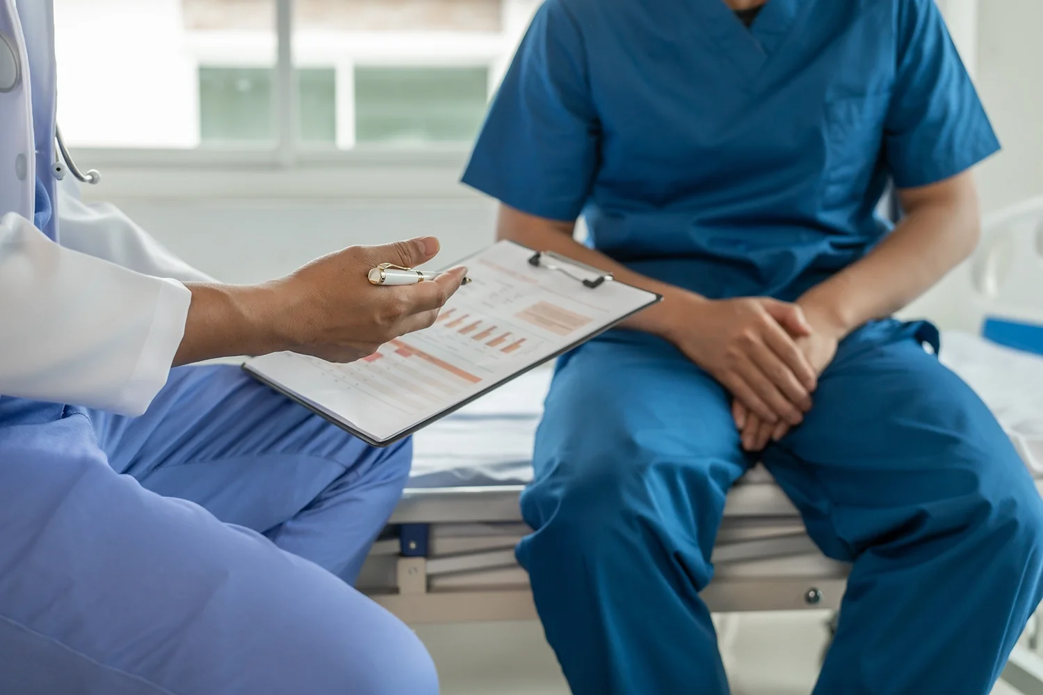 Doctor consulting patient on the cost of STD test