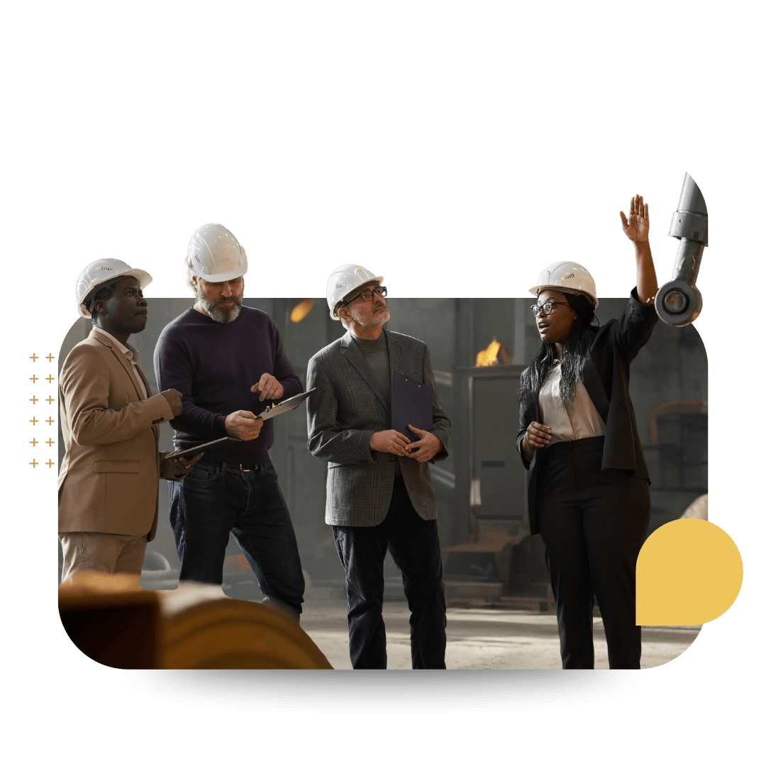 A diverse group of four professionals wearing hard hats representing CultureAlly's workplace training for construction and engineering industries.