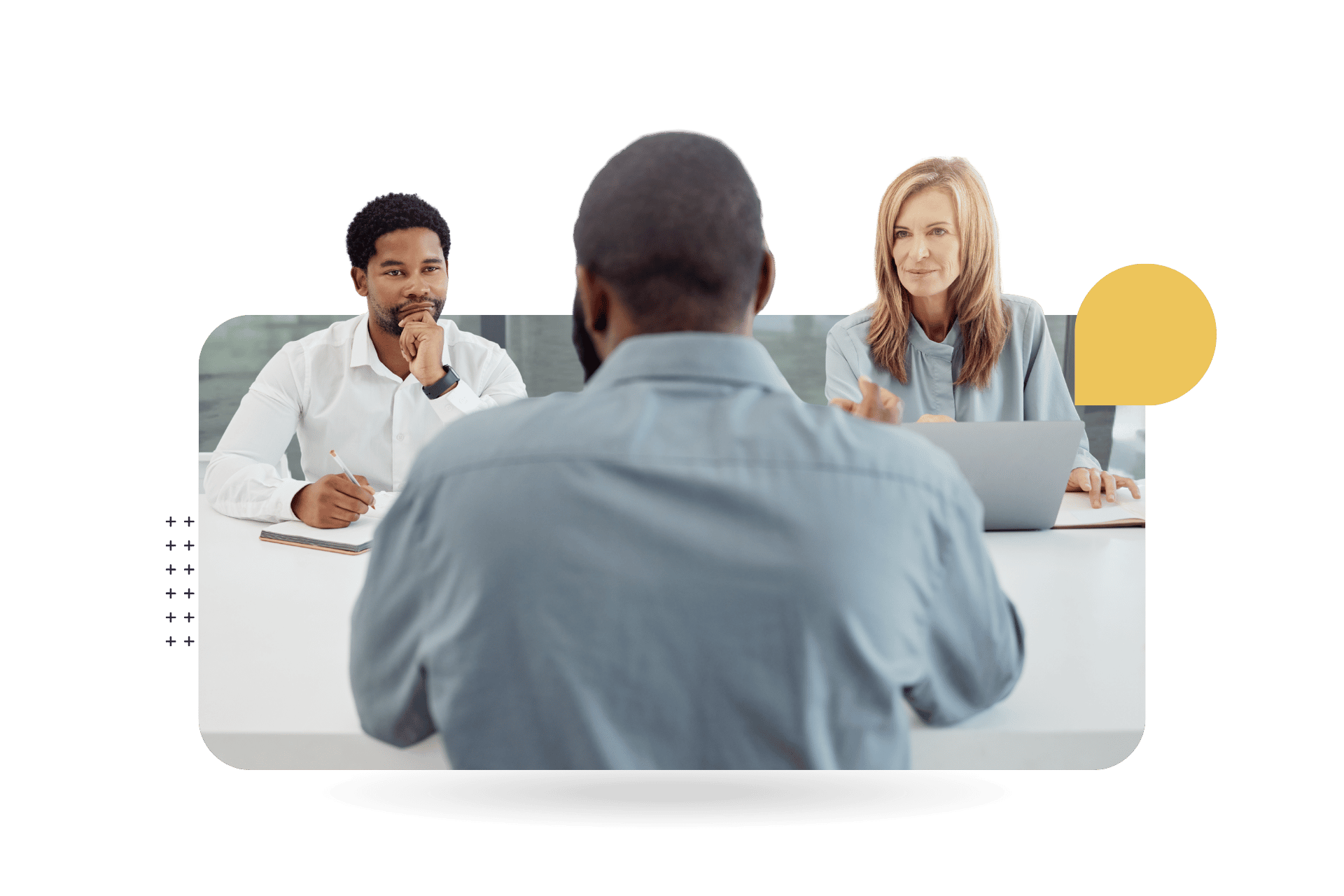 Two interviewers, a man and a woman, sit across a table from a job candidate during an interview in a modern office representing CultureAlly Interview Bias Training