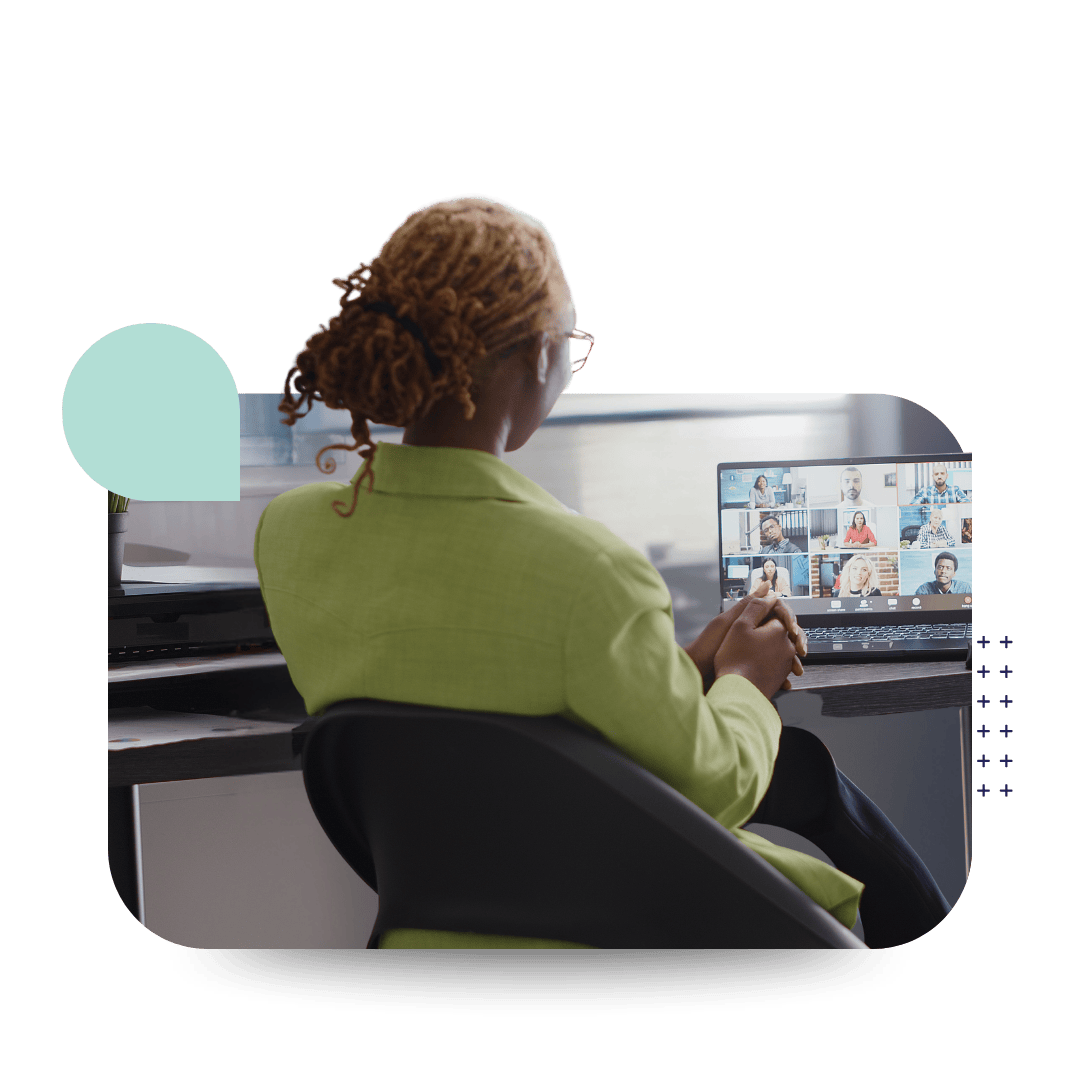 Women at laptop participating in DEI training