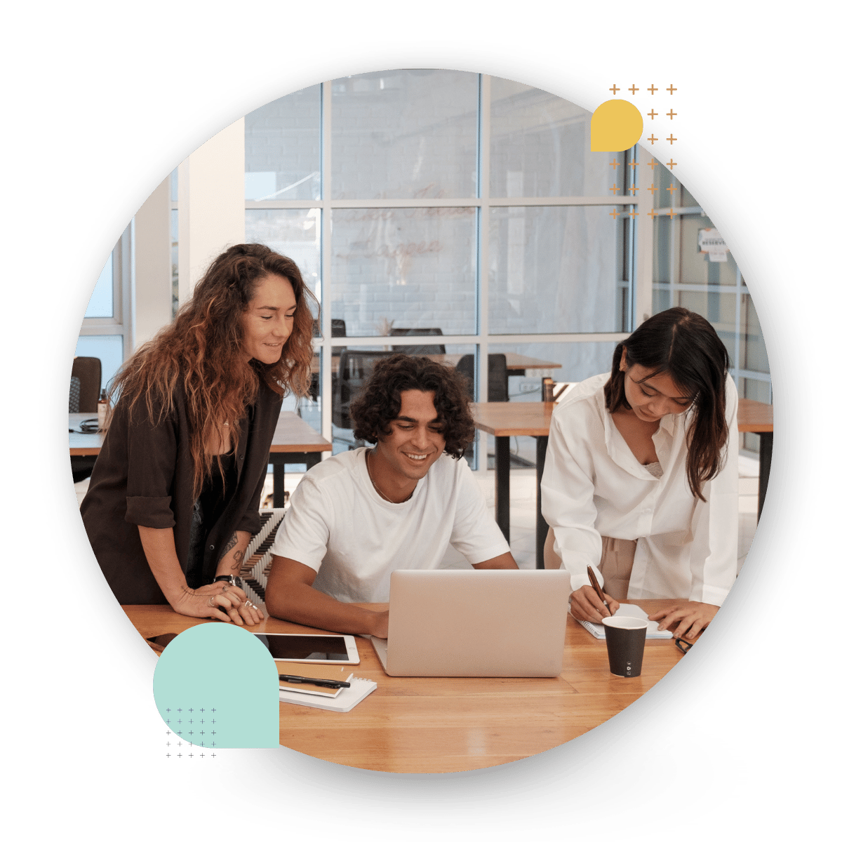 employees discussing a project on a laptop