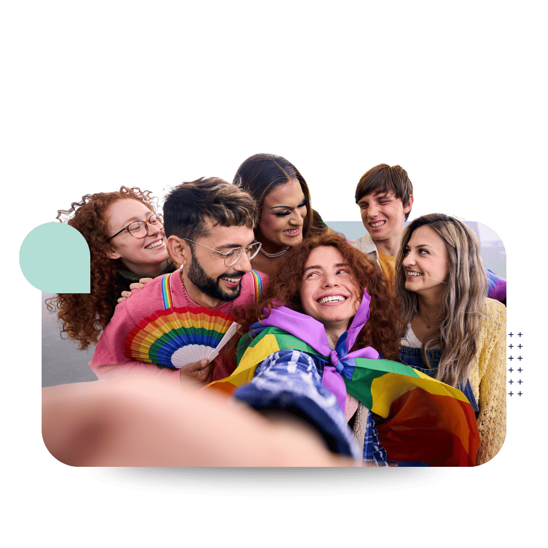 Group of people with 2SLGBTQIA+ flags in conversation.
