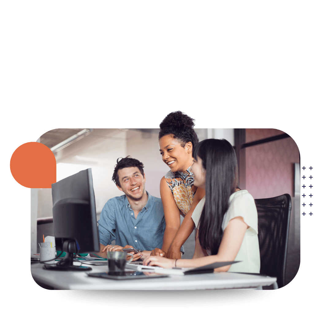 Three people smiling and working together around a computer and tablet representing CultureAlly's ConnectED elearning solution.