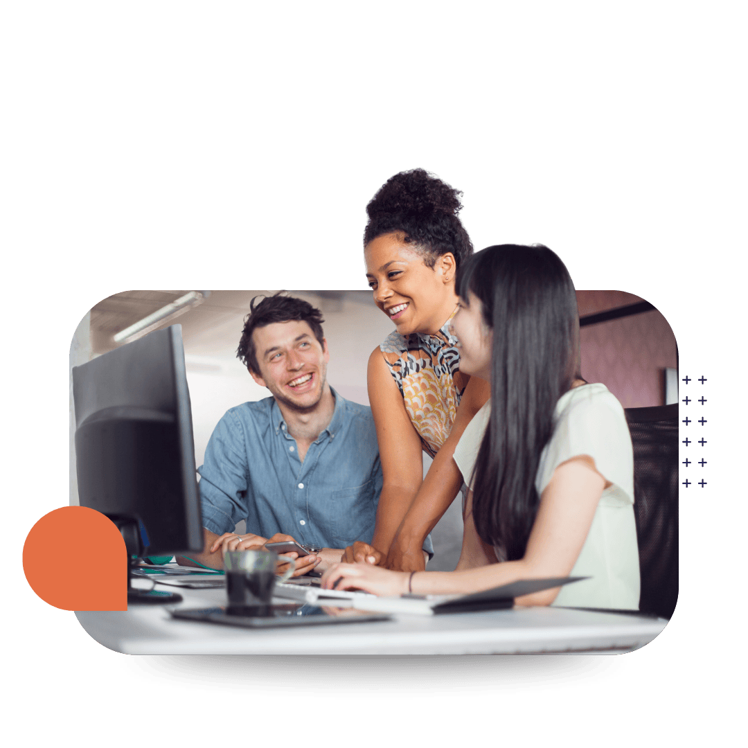 Three women in an office looking at a computer screen and smiling representing CultureAlly's ConnectED elearning
